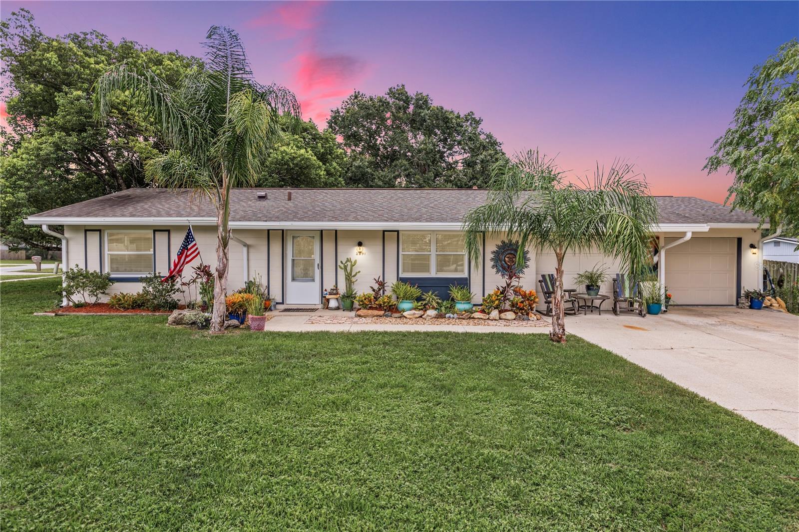 Welcome to this beautifully UPDATED 3 bed, 1.5 bath home situated on a spacious corner lot, brimming with charm and modern updates throughout including a newer Roof (2020) and HVAC (2020). From the moment you arrive, you’ll be captivated by the meticulously landscaped front yard, vibrant flower beds, and inviting curb appeal. Once you step inside you'll find a light and airy living space featuring many updates including New Windows, Crown Molding throughout, and warm wood-style flooring. The living room flows seamlessly into the dining area, enhanced by New French doors that open to the fully screened epoxy-coated back porch, perfect for morning coffee or evening relaxation. The Kitchen is a chef’s delight with custom wood butcherblock countertops, Sleek white cabinetry, a stylish tile backsplash, and modern appliances including Gas Stove. The primary bedroom offers a cozy retreat with dual windows and thoughtful wall accents. The bathrooms have been tastefully updated with a modern vanity and open shelving for added storage. The 3rd room off the kitchen has it's own private entrance, great for an in law or young adult wanting more privacy and separate entrance. This home is great to enjoy year round outdoor living in your backyard oasis with family and friends, complete with hurricane shutters on the porch, a shaded canopy lounge area, and an additional 10x15 Shed for all your storage needs. Fruit enthusiasts will love the mature blueberry, blackberry, and mulberry trees. The fenced yard offers both privacy and space to entertain. The great location leaves you conveniently near shopping, restaurants, access to I4 to make your way to the beaches or Orlando entertainment. Set up your private showing today!