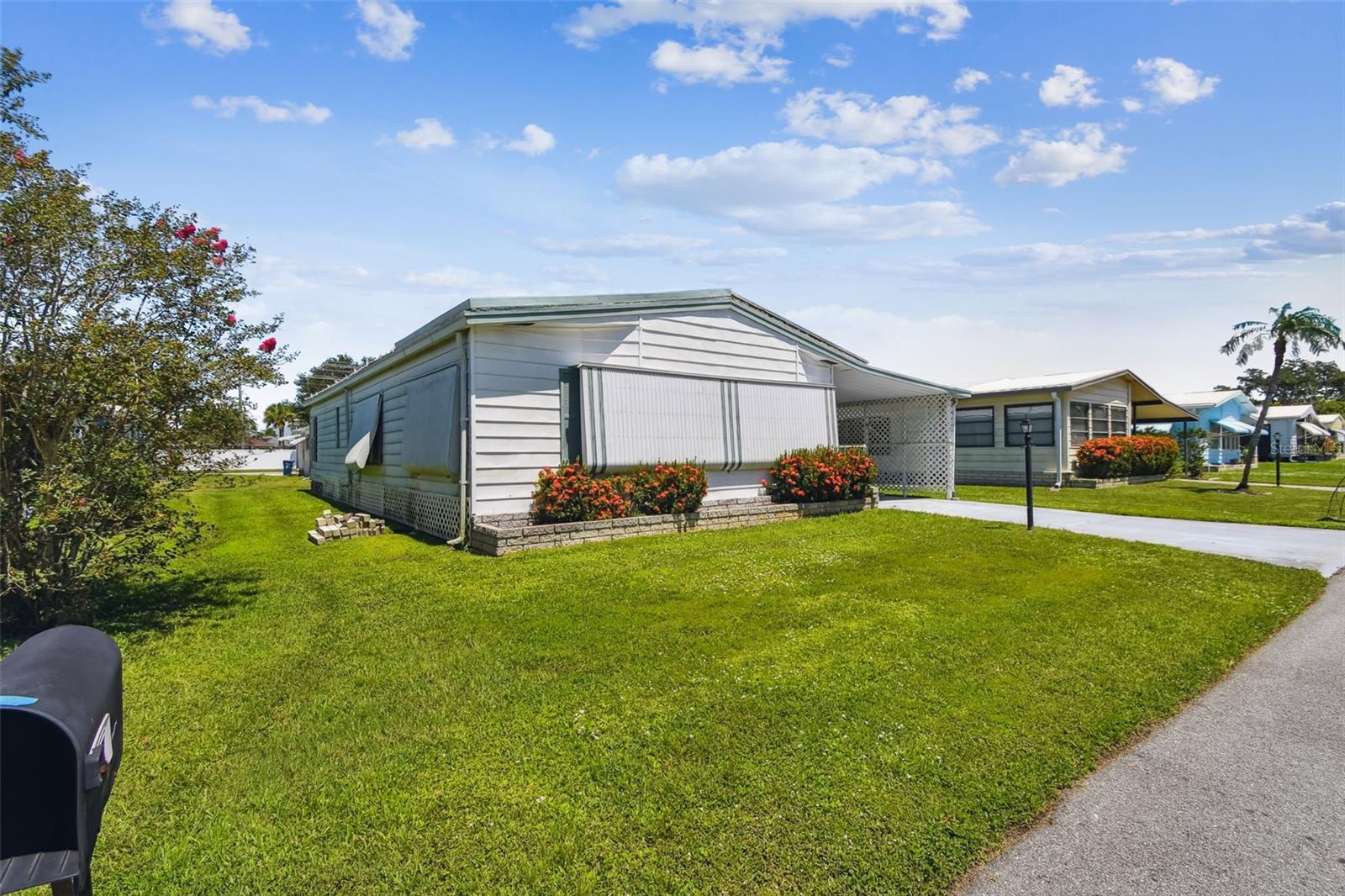 Location is everything and this mobile home has it all! Welcome to Shadow Brook! It’s simply paradise, non-age restricted, you own the land, there’s no lot rent, low fees include basic cable, internet, water, and sewer plus amenities. The community features a large heated pool with clubhouse, library, pool tables, and shuffleboard courts.
This 2 Bedroom 2 Bath mobile home offers plenty of potential at an affordable price. The property was impacted by Milton and has damage to the attached carport and utility room. The home remains weather tight.
Inside, you find a functional floor plan with a spacious living area, open kitchen, and 3 nice sized bedrooms. The primary suite includes its own private bath.
Great opportunity for a buyer looking for a project with strong upside potential. Great convenience to I275/I75 and so close to Bradenton and an easy commute to Sarasota.