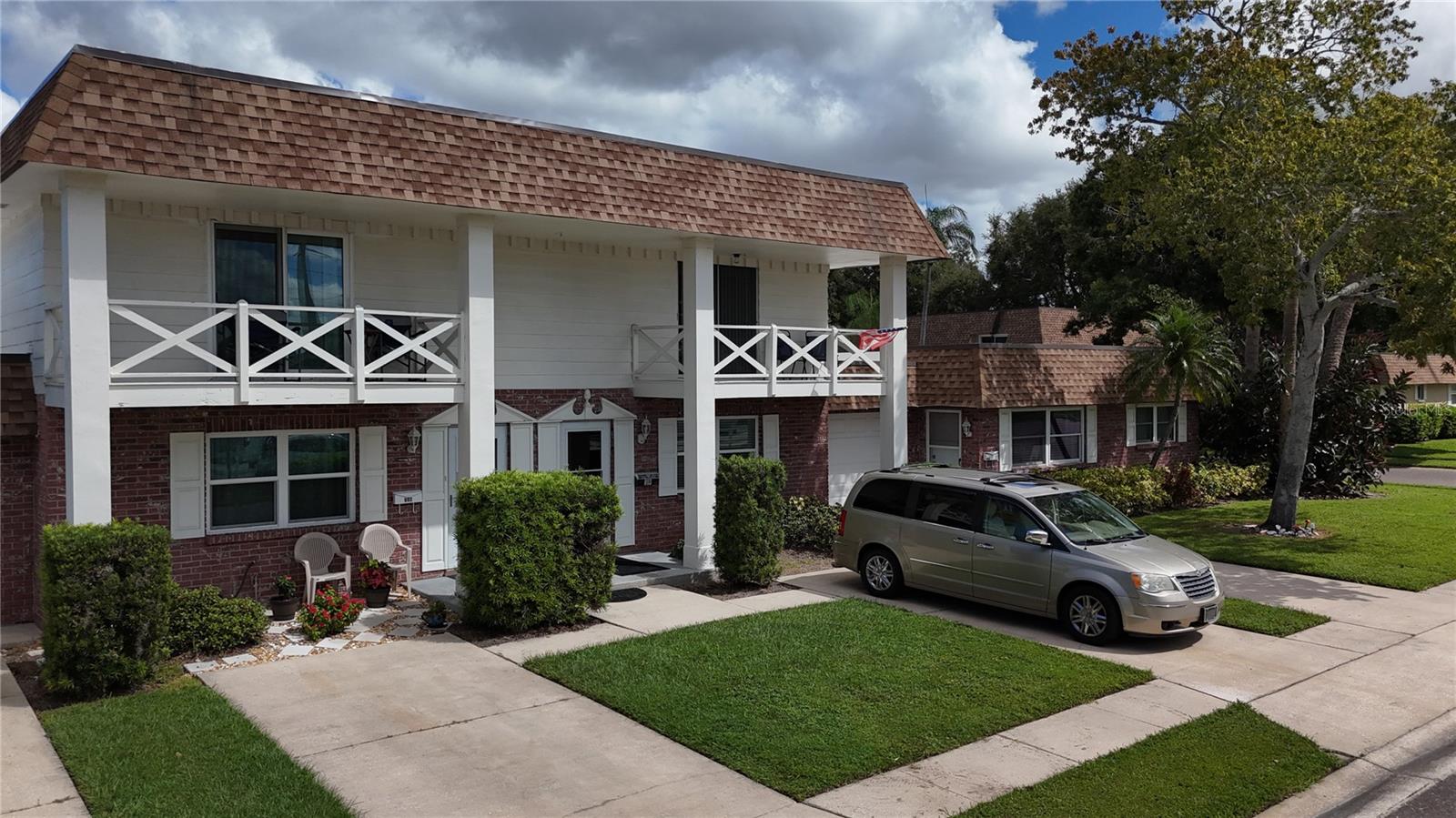 Welcome to the quaint retirement community of Rothmoor Estates. This terrific townhome has been completely and professionally updated in 2023. Beautiful luxury vinyl flooring throughout the home, gorgeous white kitchen cabinets with high end granite counters and black-stainless appliances. Both bathrooms also updated, the 1st floor powder room has new commode and vanity and the 2nd floor "Jack n Jill" bathroom is updated with a walk-in shower, dual sinks in a beautiful new vanity. Access the bathroom directly from the back bedroom or from the hallway. The front bedroom has a private covered balcony for star gazing. Other updates include: Hurrican-impact windows and sliding glass doors, HVAC new in 2024, All interior doors have been replaced, the roofs were replaced in 2019 and all the exterior of the villas were painted in 2020. The electric panel has also been updated. The community offers a clubhouse which is available for private parties and a sparkling in ground pool. Plus, the back gate of the community leads to the Largo Rec Center, with a community pool, indoor and outdoor fitness equipment, and more. Walking distance to Restaurants & Largo Cultural Center. Only 5 miles to the beautiful Gulf Coast beaches. Also close to the St.Pete/Clearwater airport, and Tampa Int'l airport. Emotional/Medically necessary pet only. Yearly renting is allowed after 1 year of ownership.