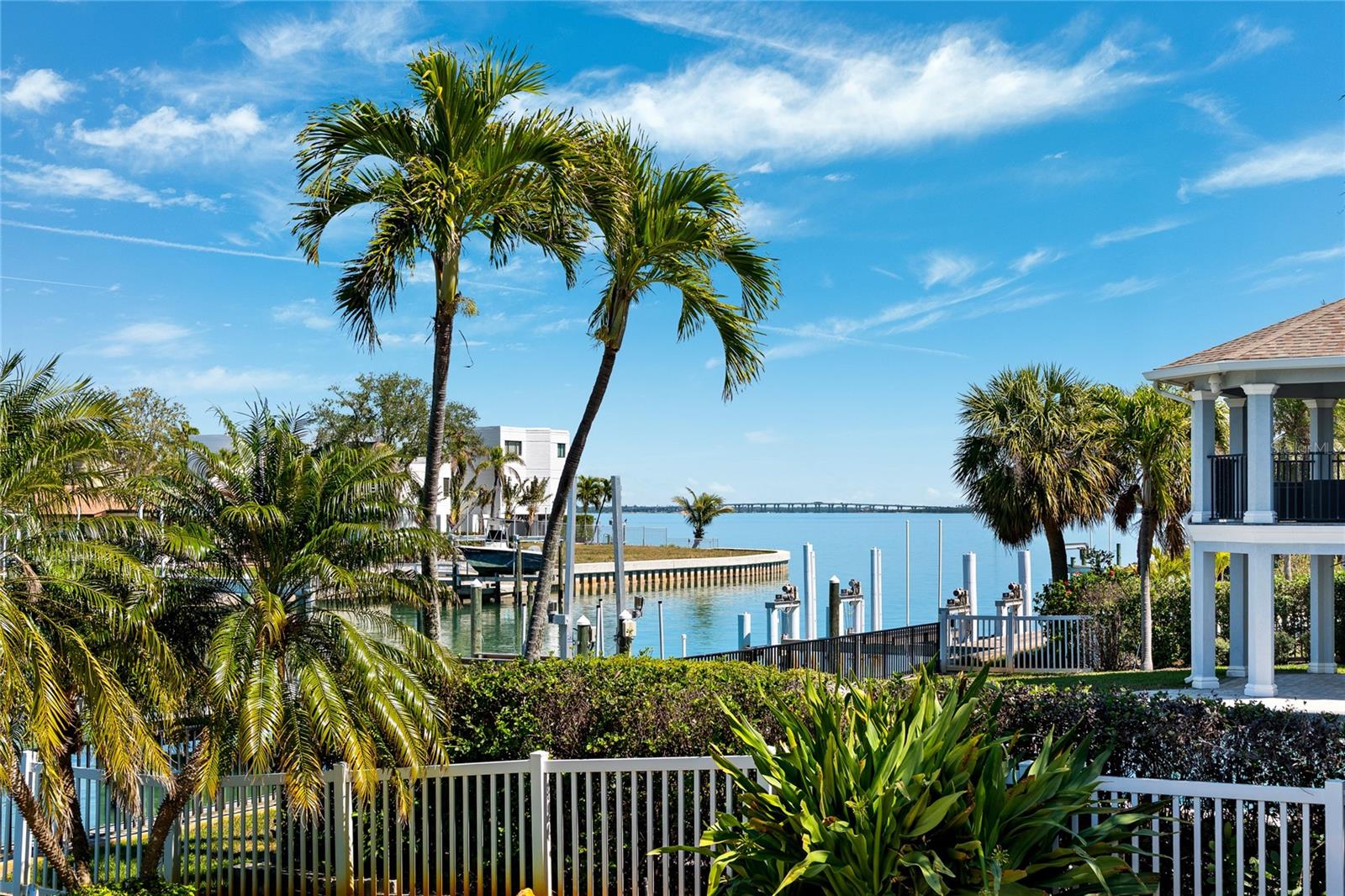 Welcome to your slice of paradise in Tierra Verde! This Rutenberg "Bimini II" home isn't just a place to live—it's your ticket to a relaxed coastal lifestyle with stunning views reaching all the way to Tampa Bay. Step into this highly desirable, well elevated, spacious 4-bedroom, 3-bathroom retreat, offering almost 2,900 square feet of easy, breezy living. The open layout draws you in from the moment you enter with 12 ft ceilings and pocket sliding doors that take you straight to a waterfront lanai and pool area. The beautiful kitchen is the centerpiece to the home with breakfast bar overlooking the casual dining and family room with wood burning fireplace and offers the chef of the family some of the best views in the house! It's the perfect spot for relaxing or throwing a pool party with friends against the backdrop of the waterfront and outdoor entertaining areas. You'll love having 85 feet of waterfront to call your own, a newly refinished pool with a beautiful travertine deck, and a dock that's ready to host a 55-60ft yacht—no bridges in your way to open water, making it a boater's dream! Built to last, this home features solid block construction, a tile roof that’s just five years old, and volume ceilings in the living areas and primary suite that add a touch of grandeur. Picture yourself starting the day with coffee as the sun comes up over the bay, or enjoying a BBQ by the pool with the sound of the waterfront in the background. This highly sought after floor plan offers a spacious 4th bedroom with a spacious bath that also serves as your pool bath. Living in Tierra Verde means you're part of a vibrant waterfront community that offers both luxury and convenience. There's plenty to do, whether it's boating, fishing, dining, biking or exploring the nearby islands. Plus, you're just a short trip away from Tampa Bay's cultural spots, dining, and beautiful beaches. This "Bimini II" home is all about embracing the good life by the water—a laid-back place where comfort meets the beauty of coastal living. Welcome to your new home in Tierra Verde!