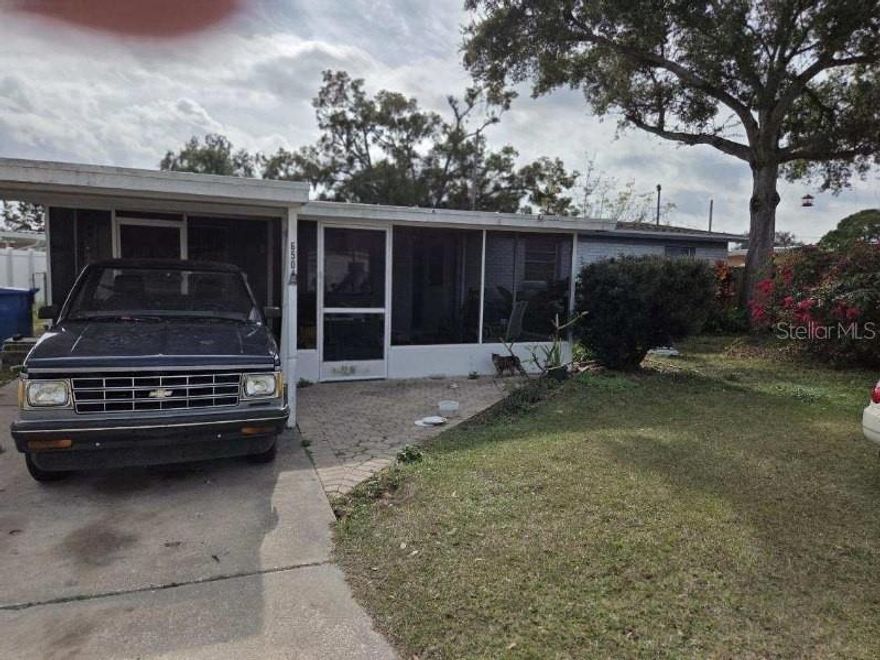 This home is a Fixer Upper.     3bedrooms, 1 1/2 bath, concrete block, 1410 SF with screen porch in front and screen porch in rear of home. New roof in 2023.  New central heat and air, new water heater. Fire place in Family Room. Home had water damage from 2024 hurricane.