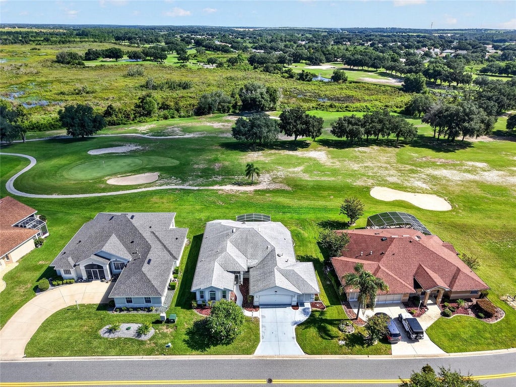 Photo of 5049 St Andrews Arcade, Leesburg, FL 34748 (MLS # G5117659)
