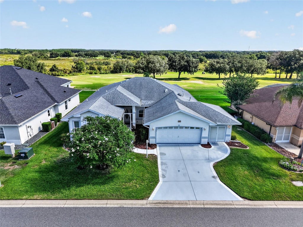 Photo of 5049 St Andrews Arcade, Leesburg, FL 34748 (MLS # G5117659)