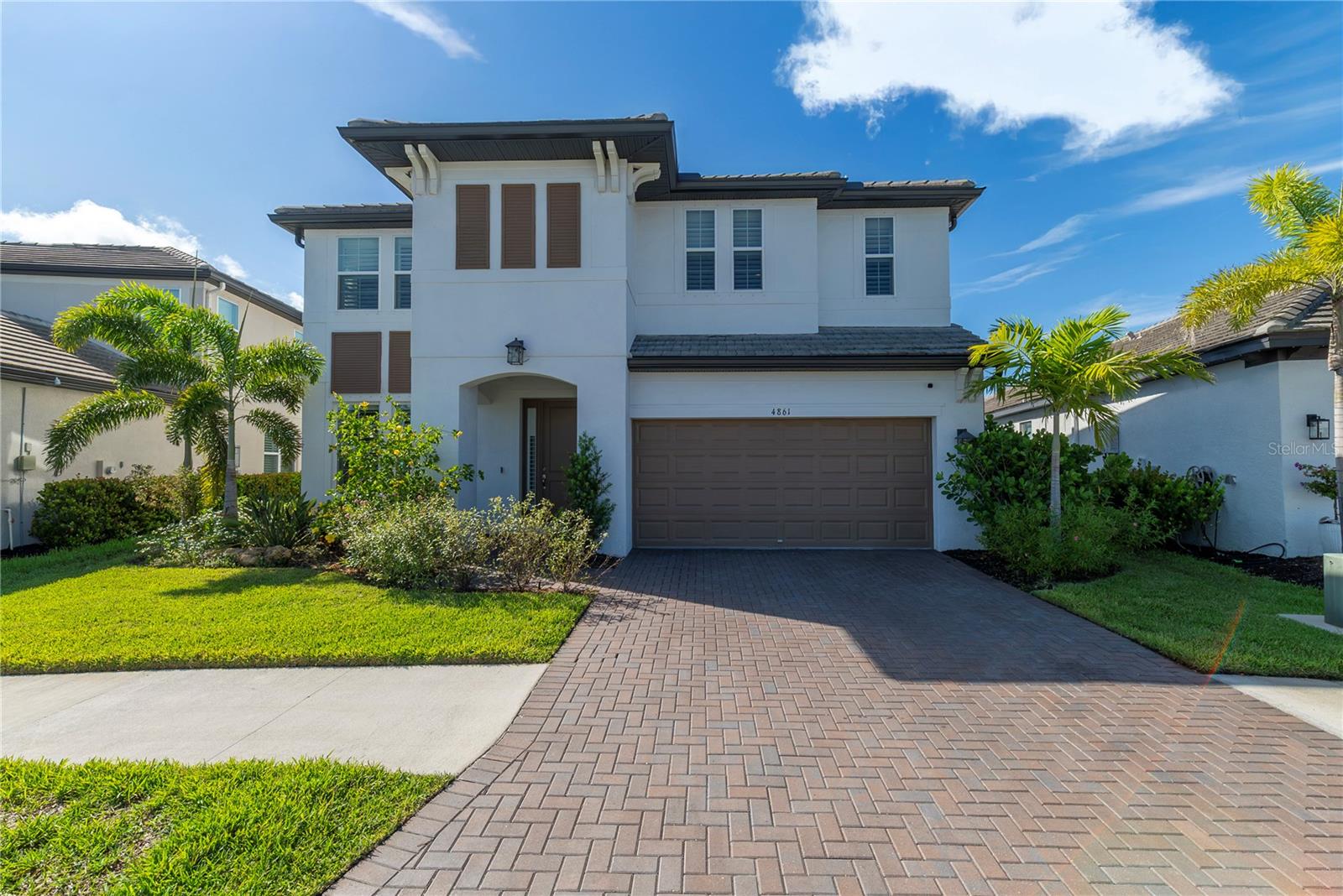It’s time to make this exquisite residence your own! This spacious five-bedroom, four-bathroom POOL home is situated within a gated community in Worthington, backing onto a serene waterfront preserve. The property boasts impressive curb appeal, featuring a paver driveway, lush landscaping, and a covered entryway, tile roof and corbels that add a touch of elegance. Upon entering, you will be greeted by high ceilings and an open floor plan, with wood-style plank tile throughout the first floor, creating a cohesive aesthetic. The formal dining room can be tailored for privacy with custom barn doors that allow for versatile usage. The gourmet kitchen awaits, equipped with stainless steel appliances, gas cooktop, an exhaust fan, built-in oven, and tall cabinetry with molding, and breakfast bar highlighted by pendant lighting. Additionally, the butler's pantry serves as an ideal space for a coffee station or extra meal preparation. Casual dining can be enjoyed in the charming breakfast nook, while the living room provides a comfortable space to relax, all while overlooking your scenic backyard oasis. One bedroom on the first floor offers flexibility for guests or can serve as an office. Ascend the stairs to discover an open loft area, perfect for a game room, media center, or other possibilities. The primary bedroom sanctuary features double doors, tray ceiling, and a walk-in closet. The ensuite bathroom includes dual sinks and a generously sized frameless glass shower. Three additional well-proportioned bedrooms are located on this floor, along with a conveniently located laundry room. Additional highlights include a water softener system, plantation shutters, ceiling fans, recessed lighting, tankless water heater, natural gas stove, dual zoned AC, tandem 3 car garage and more. Step into your backyard paradise, where you can relax under the expansive covered patio while enjoying panoramic views of the scenic water preserve. Indulge in the sparkling blue pool, have fun splashing about, or unwind beneath your very own stone waterfall feature. The fenced backyard, adorned with privacy shrubs, ensures a tranquil retreat. Located within the gated community of Worthington, which boasts low HOA fees and no CDD, residents have access to a picturesque shell walking trail winding through the neighborhood. This home is NOT in a flood zone and is conveniently located to The Classical Academy of Sarasota, Tatum Elementary, downtown Sarasota, Celery Fields, I-75, Tampa, St. Petersburg, the UTC shopping district, and the stunning beaches of Siesta Key, Lido Key, Longboat Key, and Anna Maria Island. This is a rare opportunity to own a sanctuary that beautifully blends luxury and convenience amidst a waterfront preserve.
