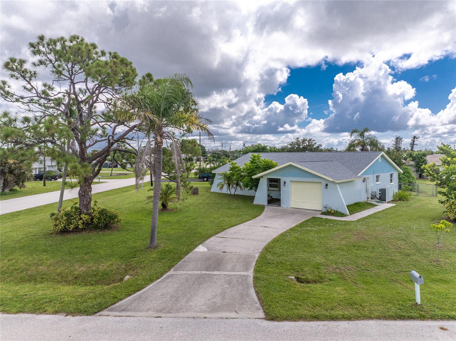 NEW ROOF 2022! NEW AC SYSTEM 2022! New Accordion hurricane shutters for 384’ tiled lanai! NOT in a mandatory flood zone so your lender will NOT require flood insurance. Take a look at this Extraordinarily well cared-for 2 bedroom/2 bath/1 car garage home in the best part of Grove City! You'll have easy access to the community boat ramp just a few blocks away! The L shaped Living/dining room offers plenty of room to entertain, with sliding glass doors from the dining room opening onto the lanai. The galley kitchen has been updated with white raised face cabinetry and solid surface countertops, recessed lighting and natural wood accent, and has a handy pass through window to the lanai. There's a closet pantry for extra storage, plus another large closet in the hallway. Appliances include: refrigerator, smooth top stove, and dishwasher. Popular Split plan provides privacy for each of the two Suites. The Primary bedroom has a walk in closet and another set of sliding glass doors to the lanai, and the Primary bath has an updated vanity, mirror, lighting and combo tub/shower! Guest bedroom is quite spacious and also has a large walk in closet, plus a 3rd set of sliding glass doors to the lanai. The Guest bath has an updated vanity, updated lighting and mirror, and entire shower has been redone! All new easy care laminate flooring throughout! Huge lanai with nonslip tiled flooring, two ceiling fans and 2 person wicker swing is the perfect place to relax in the evening or have that morning cup of coffee, and overlooks the private fenced backyard. The one car garage houses the washer and dryer and updated water heater. (2021) It’s just 4 miles to Englewood Beach, 3 blocks to your COMMUNITY BOAT RAMP providing fast and easy access to Lemon Bay and on out to gorgeous Gulf of Mexico, 3 blocks to 3 parks with a total 387 acres featuring numerous walking trails through woodlands and coastal habitat, as well as children’s playgrounds. 2.9 miles to Walmart and 1.6 miles to Publix! This little gem will not last long! Don't shovel snow any longer - make this your Florida dream home!