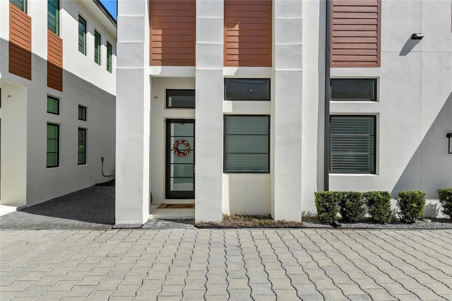 Walk to Park Avenue! Model Home, tons of upgrades. Enjoy luxury living and premium sought after location at Vilasa Homes in Winter Park, FL 32789.  Park Avenue lifestyle, arts and culture, a mini-version of Manhattan’s Central Park, brick streets, historic neighborhoods, area’s hottest restaurants, shopping and the prestigious Rollins College. Modern finishes for this 2-story townhome personally selected by one of the nation’s top interior designers. Handpicked design team of Nasrallah Architectural Group, Ted Maines Interiors and Jordan Builders. Alys Beach inspired incorporating wood accents, architectural stairway, wrought iron and two-story ALL BLOCK construction all steps away from downtown Winter Park. Energy saving features such as Pella double pane windows and extra insulation. Home prewired for surround sound, cameras, alarms system etc. Beautifully appointed- engineered wood flooring throughout, recessed lights, level four wall finishes, 13 foot ceilings on the main floor and 10 foot ceilings upstairs. Chef’s gourmet kitchen is complete with high-end flat panel cabinetry, Quartz countertops, island, Wolf gas cooktop and Subzero appliances overlooking landscaping and greenery. This unit is totally upgraded! Quartz counters and backsplash, tall upper kitchen cabinets and staircase lighting (a $65k value). Spacious master retreat on second floor. Rest in your garden tub and oversized walk in shower, Quartz countertops, designer tile, Koehler fixtures/ bathroom accessories and custom lighting treatments. Two more suites that can be used for exercise, office or bedrooms. Generous closet and storage spaces. 2-car garages featuring insulated steel garage doors. The Canton townhomes each have a backyard measuring approx 40ft x 11ft. with a 28ft x 4ft patio slab which extends from the sliding doors and brand new artificial turf. Convenient and minutes from Hillstone, Whole Foods, Trader Joes, restaurants and premier shopping. Top rated 9 hole Winter Park Golf Course, Casa Feliz, Morse Museum, water sports, Rollins and churches are all short stroll away.