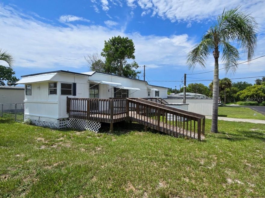 Opportunity Found!  Beautifully updated home with new kitchen cabinets, new stainless steel appliances,  and quartz countertops.   Desirable and durable luxury vinyl plank flooring, new lighting, new water heater, and fresh paint inside and outside.   Additionally, both the full bathroom and half bath were updated.   The property has central heat and air, a dedicated well with a new pump, and its own septic system, which helps keep monthly bills down.   This corner lot is included in the sale, so that the homeowner has no lot rent and no land lease.   There is a civic association for the care of the community, but no mandatory HOA fees. This lot is a nice size and features a fence for your dog. All ages and pets welcome.  The home is located at the end of the street for a quiet, peaceful setting and features a wood deck at the front door. The home has a small covered carport, and a block shed for storage and laundry. Cash sale. Estate Sale. Priced to sell, please contact us today!