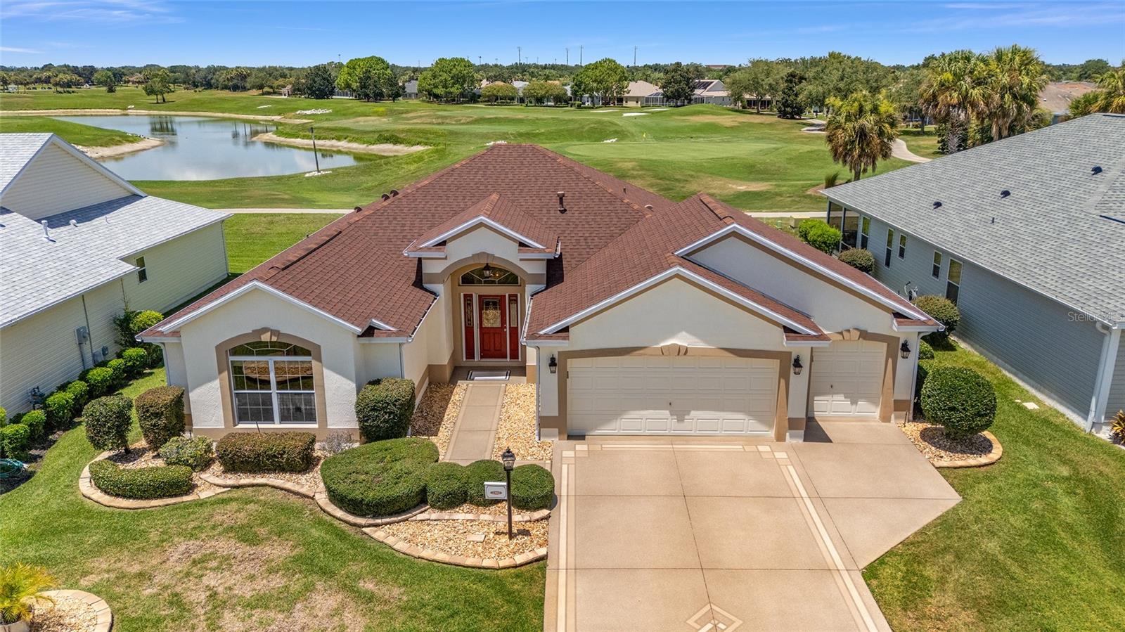 Welcome to the Village of Bonnybrook!
Experience the charm and beauty of this gorgeous Lantana model home—a spacious 3-bedroom, 2-bath gem with a golf cart garage, perched right on the 6th hole of the Pimlico Golf Course with breathtaking water views! .3M from Bonnybrook Adult Pool!
BOND PAID! Roof (2022) | HVAC (2021) | Natural Gas Home.
From the moment you arrive, the painted driveway and walkway set the tone for this spectacular property. Step through the lovely leaded glass front door with dual side panels, and you’ll be instantly captivated by panoramic views of the golf course and sparkling pond.
Inside, you’ll find soaring 10-foot ceilings that add a sense of grandeur throughout much of the home. The open floor plan is perfect for entertaining or relaxing in style.
The guest wing is smartly positioned at the front of the home, offering privacy and separation from the spacious primary suite.
The open kitchen boasts granite countertops, a closet pantry, and convenient pull-out shelves in the lower cabinets—everything you need for effortless cooking and entertaining.
The inside laundry room is a dream with pedestal washer and dryer, utility sink, and extra cabinetry for added storage.
Whether you’re sipping your morning coffee or enjoying evening breezes, the acrylic-enclosed lanai provides the perfect spot to soak in the serene views. Prefer the fresh air? Head out to the back patio and watch the golfers go by!
This home is more than just a place to live—it’s a lifestyle. Don’t miss your chance to own a slice of paradise! Be sure to watch the attached video for a great overview of this home!!