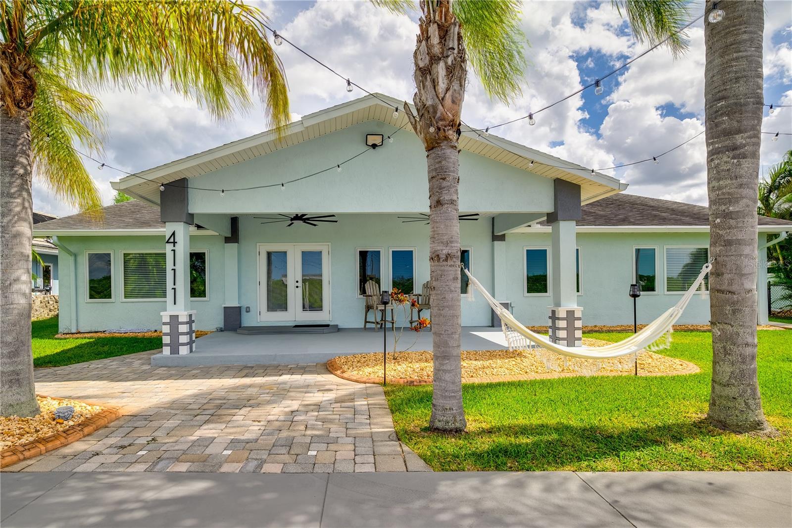 One or more photo(s) has been virtually staged. Completely renovated 3100+ sq ft waterfront ranch in Gulf Harbors Woodlands! This open concept home features a chef's kitchen w/ ice maker, double door refrigerator, soft close wood cabinetry, LED lighting and bonus flex room for office, nursery or gym. Canal-front w/10,000 lb boat lift+45x12 dock for easy Gulf access. Dual-zoned A/C and modern finishes throughout. Community offers pool, private boat ramp and optional Gulf Harbors Beach Club membership with private beach, volleyball, concerts and event rentals. Florida waterfront living at its best! Seller is offering a $50,000 credit to buyers.
