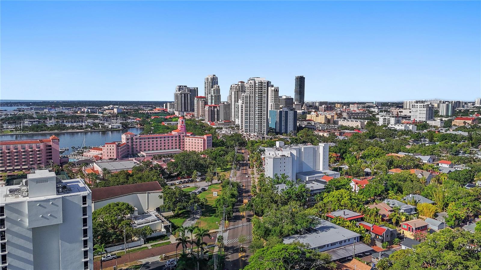 Welcome to this beautifully updated first floor condo in the highly desirable Harbour Hill, a quiet and friendly 55+ community ideally located in the heart of downtown St. Petersburg and perched on iconic Beach Drive. This spacious residence offers the perfect blend of comfort and convenience, with only two other neighbors sharing a private hallway and exclusive access through a private back entrance—making daily errands, like unloading groceries, easy and elevator-free.
From your front porch, enjoy peaceful views of Beach Drive and the iconic five star Vinoy Resort, framed by manicured privacy landscaping. This prime location puts you just blocks from St. Pete’s scenic waterfront parks, boutique shops, cafés, marina, and world class cultural attractions like The Dalí Museum and the Museum of Fine Arts. Nearby, North Shore Park offers beach access, dolphin watching, volleyball courts (in the sand!) and a public aquatic complex.
Downtown St. Petersburg is known for its sunshine, year-round calendar of events, including art festivals, live music, holiday boat parades, farmers markets, and more—all just outside your door. Albert Whitted Airport is just minutes away, and Tampa International Airport is a convenient 25–30 minute drive.
The condo offers a newly renovated 9th floor hospitality level with sweeping views of the downtown skyline—perfect for sunset gatherings. Residents also enjoy complimentary use of the rooftop hospitality suite, ideal for birthdays or special occasions.
The building is not located in a flood zone, the unit #102 and the parking garage has never flooded, even during major storms. Additionally, Harbour Hill has completed and passed its milestone inspections, offering peace of mind to residents and future owners alike.
This turnkey unit has been extensively updated in 2025, including fresh interior paint throughout its 1,300 square feet and the removal of all popcorn ceilings for a smooth, modern finish. NuCore waterproof luxury vinyl plank flooring in a neutral beige tone was installed throughout the entire unit, offering both durability and style. Custom motorized white blinds with blackout backing were added in the living room by 3 Day Blinds and come with a lifetime warranty. Fully motorized hurricane shutters were installed by Storm Shutter Specialists and are backed by a two-year warranty. The primary bathroom was also refreshed with a new, modern vanity.
Whether you’re enjoying the view from your porch or heading out to explore everything downtown has to offer, this condo delivers low-maintenance living in one of St. Pete’s most sought after communities.