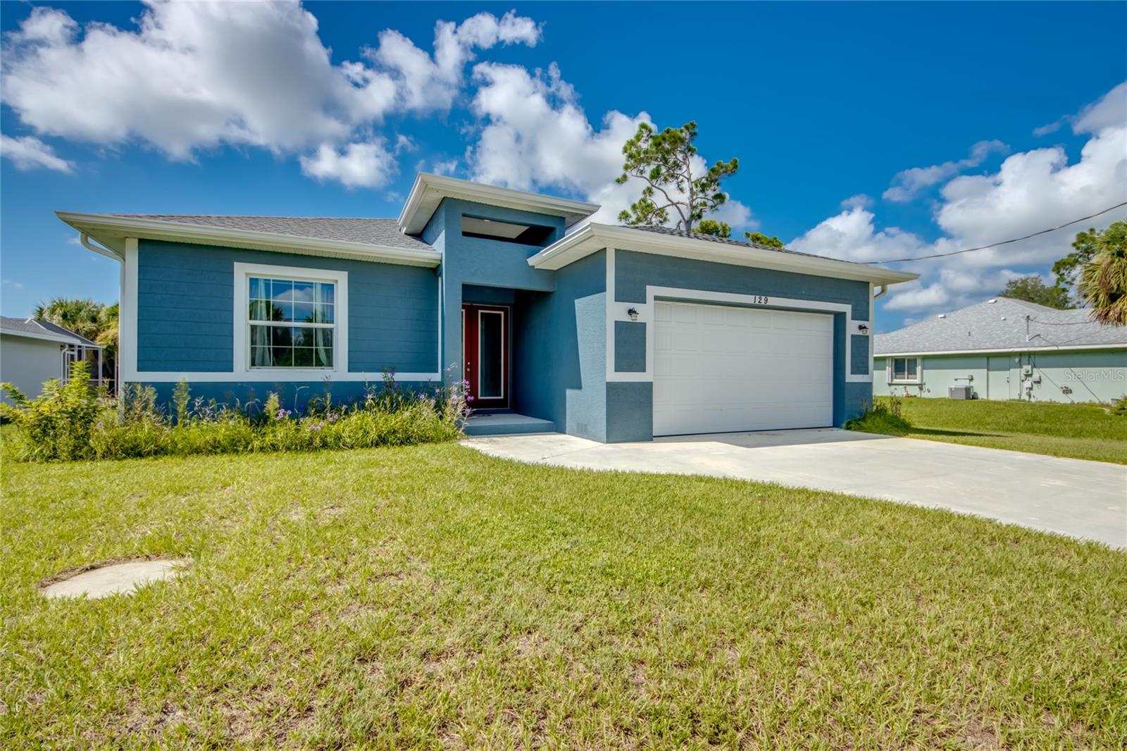 Discover this stunning 2021-built 3-bedroom, 2-bath home in sought-after Rotonda West, showcasing modern elegance, quality construction, and Florida living at its finest. Built on a stem wall with impact windows and doors, this home offers peace of mind and currently requires no flood insurance. Step through the French glass-paneled doors into the open floor plan, where large impact sliders fill the home with natural light and provides access to the screened-in pool area from the living room, kitchen, and owner’s suite. The home is highlighted by tray ceilings in both the living room and owner’s suite, tall raised panel doors, LED lighting, and beautiful porcelain wood-plank tile that stretches seamlessly throughout. The kitchen and features granite countertops, stainless steel appliances, and plenty of counter space that glows under the LED lighting. The owner’s suite offers private pool access, a spacious walk-in closet, and a luxurious bath with an oversized walk-in shower, granite countertops and dual sinks.. Guest bedrooms are located at the front of the home and are split by the guest bathroom, which features a tub-and-shower combo. The custom saltwater pool boasts a large sundeck, electric heater, and expansive covered lanai—perfect for year-round enjoyment. Additional highlights include an extended garage for extra storage. With meticulous attention to detail and a design that blends comfort with style, this home delivers the ideal Florida lifestyle in a prime location close to beaches, golf, and all that Southwest Florida living. Rotonda is rich with history and features a well-thought-out design, providing easy access to the area’s top beaches.