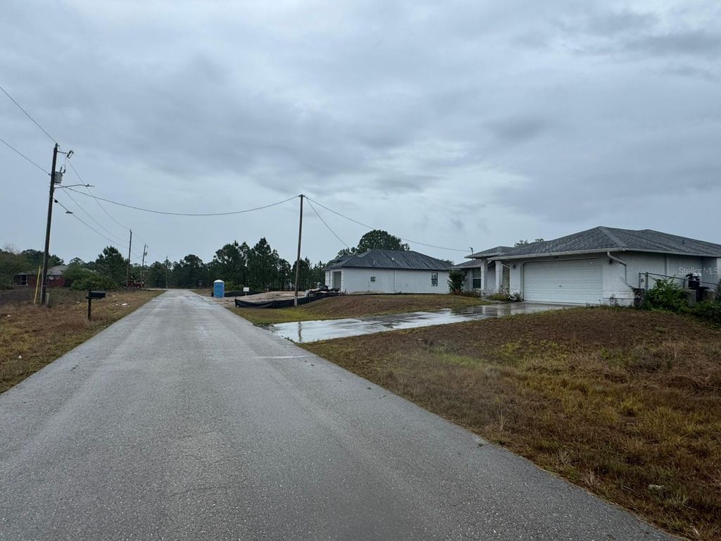 Photo of 1142 Ecrue Street E, Lehigh Acres, FL 33974 (MLS # O6321279)