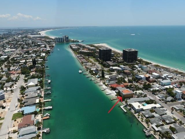 Dont' miss your chance at this amazing property, PRICED BELOW CURRENT APPRAISAL AND ASSESSED VALUE! SELLER HIGHLY MOTIVATED! BRING ALL OFFERS! BEST PRICED WATERFRONT property in the area at only $353.46 per square foot for this beautiful WATERFRONT property! This property is MOVE-IN READY and PRICED RIGHT for a quick sale. This listing is truly a "ONE OF A KIND" home that is a must see with an AMAZING FLOORPLAN and PANORAMIC VIEWS nestled in the desirable Sunset Beach Community! This gorgeous property has water views of both the Intracoastal Waterway and the Gulf of Mexico and offers the FINEST IN COASTAL LIVING. Custom built ABOVE GRADE in 2002 by a local builder, this three-story home was constructed with EXCELLENT standards using CONCRETE AND STEEL CONSTRUCTION throughout and is ENERGY EFFICIENT. This home is ELEVATED so the flood insurance is less than $1,000 per YEAR! This SPACIOUS home has a total of 6,210 sq. ft living space with 4,450 sq. ft on the second and third floors with 6 bedrooms, 5 Full Baths, and 2 half baths. There is additional BONUS space on the ground floor of 1,760 sq ft with a separate HVAC system which is an incredible area for entertaining. BOATER'S PARADISE with 60 feet of waterfront on the wide and deep Blind Pass Intracoastal Waterway with a 40 ft dock! From this GATED, tropically landscaped property you’ll have a leisurely TWO MINUTE STROLL TO SUNSET BEACH and LESS THAN HALF MILE BOAT RIDE from your dock to the open waters of the Gulf of Mexico with no bridges between the property and the Gulf for some of the finest yachting, sailing, and fishing. Come enjoy life in Sunset Beach Community and LIVE WHERE OTHERS VACATION! Don’t miss this one and bring your offer today!