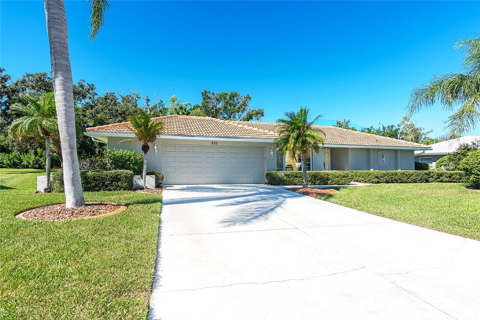 Welcome to coastal living! Nestled in prestigious Englewood Isles, this 3-bedroom, 2-bathroom, 2-car garage home is a true gem that combines elegance with comfort. Experience culinary delight in the expansive chef's kitchen featuring a large granite island with seating. It's the perfect space to entertain or simply savor your morning coffee in style. The seamless flow of this home is highlighted by the formal dining room and a cozy breakfast nook that opens up to the kitchen. Imagine creating lasting memories with loved ones in this inviting and well-designed space. The family room, adorned with skylights and a wood-burning fireplace, exudes a warmth that instantly makes you feel at home. Whether it's a quiet evening or a gathering of friends, this space is perfect for every occasion. Easy access via French doors to the private, enclosed tiled lanai which offers a serene wooded view. The guest bath offers direct access to your outdoor oasis or your future pool. Just blocks from the Englewood Isles Marina, this property offers the option for boat enthusiasts to secure a boat slip with Gulf of Mexico access. Boat Slip A5 with lift and marina-supplied electricity and water, available on separate contract. The Seller is generously offering the buyer first right of refusal on the boat slip, ensuring your waterfront dreams are within reach. This home comes with eligibility for membership in the Englewood Gardens Beach Club. Enjoy the luxury of a private beach, designated parking, restrooms, and clubhouse facilities. The home has a new tile roof and includes hurricane shutters, providing not only style but also the assurance of a secure and protected home. Englewood Isles is a short distance to the beaches of Manasota Key, historic Dearborn St, many golf courses, shopping and fine dining. Don't miss the chance to make this residence your own piece of paradise. The unique combination of luxury, location, and lifestyle awaits. Contact us today to schedule a private tour and take the first step toward coastal living at its finest.