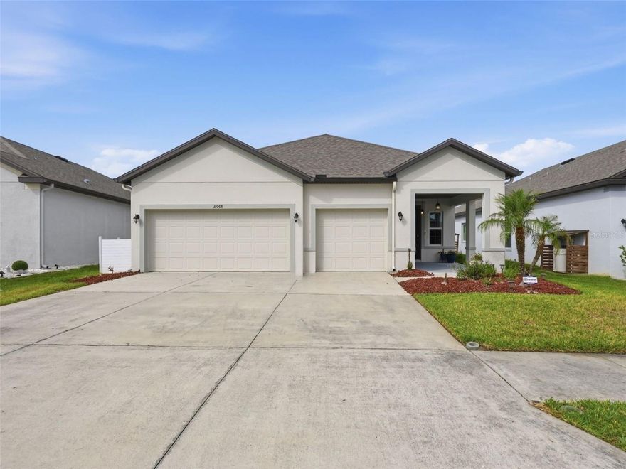One or more photo(s) has been virtually staged. Welcome to this beautifully maintained 2021-built home in the Mirada community of San Antonio, where modern comfort meets the Florida lifestyle. Perfectly positioned with no rear neighbors and peaceful pond views, this three-bedroom, two-bathroom residence offers privacy and exceptional indoor-outdoor living. Inside, you’ll find an open and airy floor plan highlighted by high ceilings and a deluxe interior trim package featuring upgraded baseboards, crown molding, and elegant wood window trim. The spacious living and dining areas seamlessly flow into the heart of the home -  a stunning kitchen designed for both entertaining and everyday functionality. Enjoy a large center island with pendant lighting, stainless steel appliances, soft-close cabinetry, abundant cabinet storage, and a separate pantry for added organization. The spacious primary suite serves as a relaxing retreat with tranquil water views, a large walk-in closet, and an attached bathroom complete with a dual-sink vanity, glass-enclosed shower, and private water closet. The additional bedrooms are nicely sized and feature ceiling fans for added comfort and share a full bathroom with a tub/shower combo. A versatile bonus flex room provides the perfect space for a home office, playroom, gym, or additional lounge area. Additional conveniences include a dedicated laundry room with lower cabinets with folding counter space, and a utility sink located in the garage. Built with an OSB radiant roof barrier, this home was designed with energy efficiency in mind. Step outside to enjoy the extended screened-in covered patio with ceiling fans, creating the perfect setting for relaxing mornings, outdoor dining, or enjoying the peaceful pond view year-round. The fenced backyard provides additional privacy and room to enjoy the outdoors. Located less than a mile from the renowned Mirada Lagoon, residents enjoy access to one of the nation’s largest crystal lagoons featuring resort-style amenities and endless recreation. Conveniently situated near grocery stores, dining, SR 52, and I-75, with Wiregrass Mall and Tampa Premium Outlets just 20 minutes away, this home offers the ideal balance of tranquility and accessibility. Schedule your visit today!