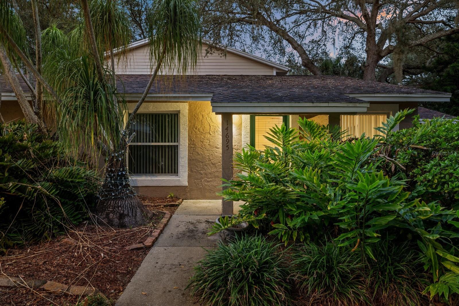 This property offers a comfortable lifestyle in a community surrounded by nature, with mature trees that create a serene and welcoming environment. Residents can enjoy a variety of amenities including a community pool, tennis and a playground, all within a green setting that promotes relaxation and outdoor living.
The home features three bedrooms, two full bathrooms, a cozy living room, and a separate kitchen with an ideal dining area. The backyard stands out with its beautiful, long-standing trees that provide shade and character, creating the perfect atmosphere for spending afternoons outdoors. The heated living area is approximately 1,160 square feet, offering a practical and well-designed layout for everyday living.
The location is strategic for those who want convenience and accessibility. It is close to the University of South Florida, Tampa International Airport, and provides easy access to both I-75 and I-275, making it simple to move around the city and connect to neighboring areas.