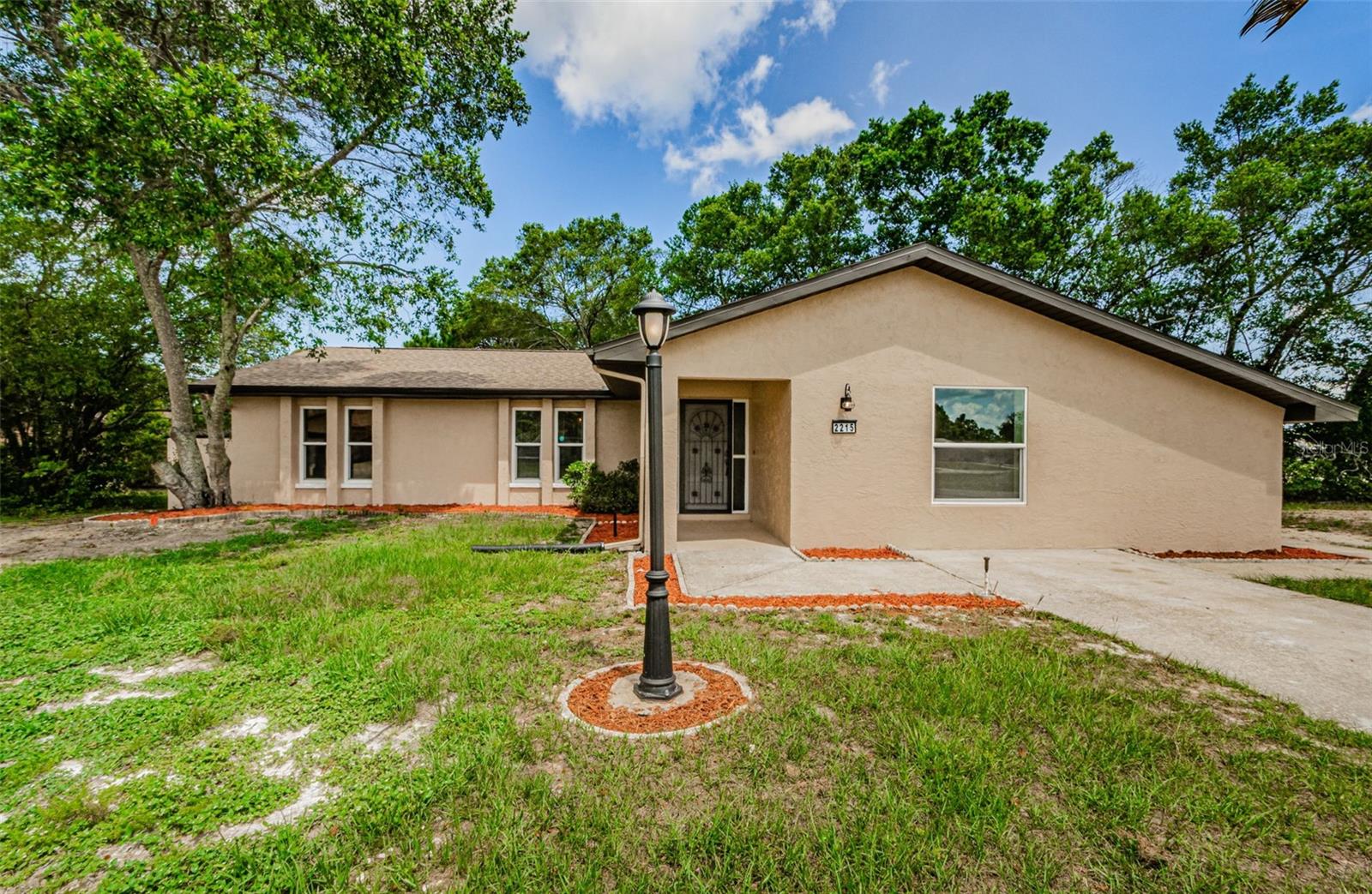 Renovated to perfection!!! Better than new! Beautiful 4 bedroom open floor plan one level home on a large, corner lot. New roof, A/C, Septic, windows, completely remodeled kitchen and bathrooms, with stainless steel appliances, new paint, baseboards, luxury vinyl flooring. Closet space galore in addition to the interior and spacious laundry room. Location is convenient to schools and shopping. Don't miss out!