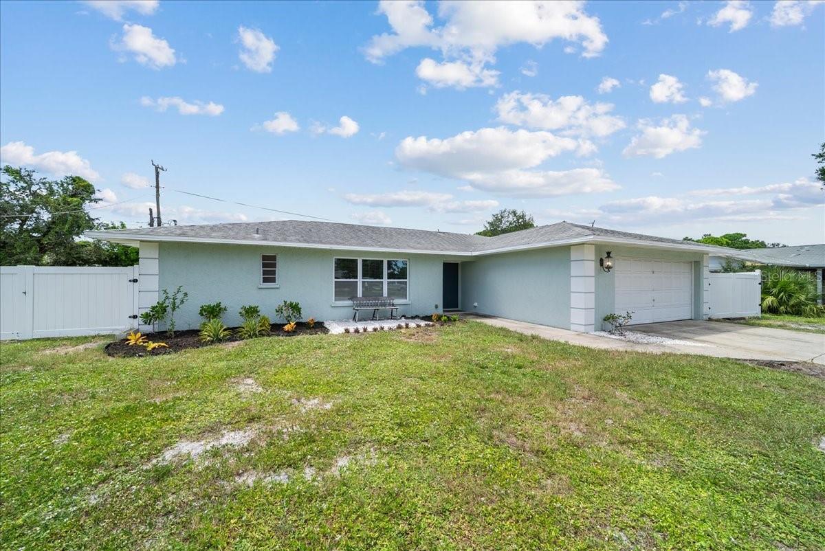 Open, airy, and move-in ready in West Bradenton! This light-filled split-plan home features tile floors throughout for easy coastal living. The updated kitchen is the heart of the home, showcasing granite counters, stainless steel appliances, and excellent flow to the dining and living spaces—perfect for everyday comfort and effortless entertaining. The private primary suite includes an en-suite bath, while guest bedrooms are tucked away on the opposite side for ideal separation.
Step outside to a spacious backyard with a covered lanai—plenty of room to grill, dine al fresco, play catch, or add a garden. With its central West Bradenton location, you’re close to everyday conveniences and some of the area’s best outdoor and cultural spots: stroll the Bradenton Riverwalk along the Manatee River, explore the trails and waterways at Robinson Preserve, and enjoy sugar-sand Gulf beaches on Anna Maria Island just a short drive away. If you’ve been looking for a well-kept, easy-living home in a prime location—close to the riverfront, parks, preserves, and the coast—this is the one. Come see why West Bradenton continues to be a favorite for its access, amenities, and relaxed Florida lifestyle.