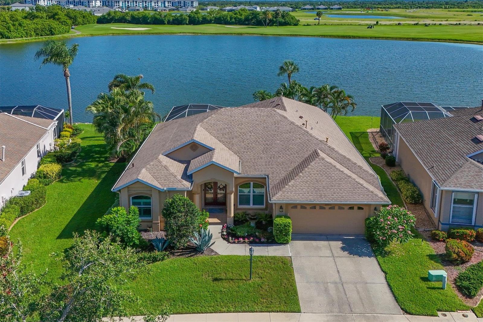You're going to set your social media on fire with sunset photos here as this Greenfield Plantation home offers incredible views of the 16th green complex as there are no neighbors blocking the OMG view - which can be yours today. Hand selected for the view, this 4 bedroom 3 bath home built by Medallion Homes features many new items for you to enjoy, from a completely rebuilt kitchen featuring a KitchenAid stainless steel appliance package to hand selected quartz counters and new cabinetry, a roof replacement, and IMPACT WINDOWS plus Kevlar blankets on the back lanai and front door provide that sense of security and lower insurance one cherishes. Bathroom counters have been replaced with high-end stone, crown molding, new LED lighting and more complete the package here. Current owner using bedroom 4 as an office - and who can blame them as THAT VIEW is outside the corner windows!
Greenfield Plantation is located oh-so-close to Lakewood Ranch, great for shopping options like Costco, target, a new Whole Foods scheduled, Aldi, Publix and more! Commuting to St Pete or Tampa is a breeze as it's within a few miles of I 75 and the ever-growing University Town Center Mall is just 2 exits south on I 75. Plenty of Golf options here in the I75 corridor with a public access course in the community and less that 2 miles away is Waterlefe Golf Club - host to 7 local US Open qualifiers! Come check out the view and what this home offers and you'll know why this Greenfield Plantation house will be your home.