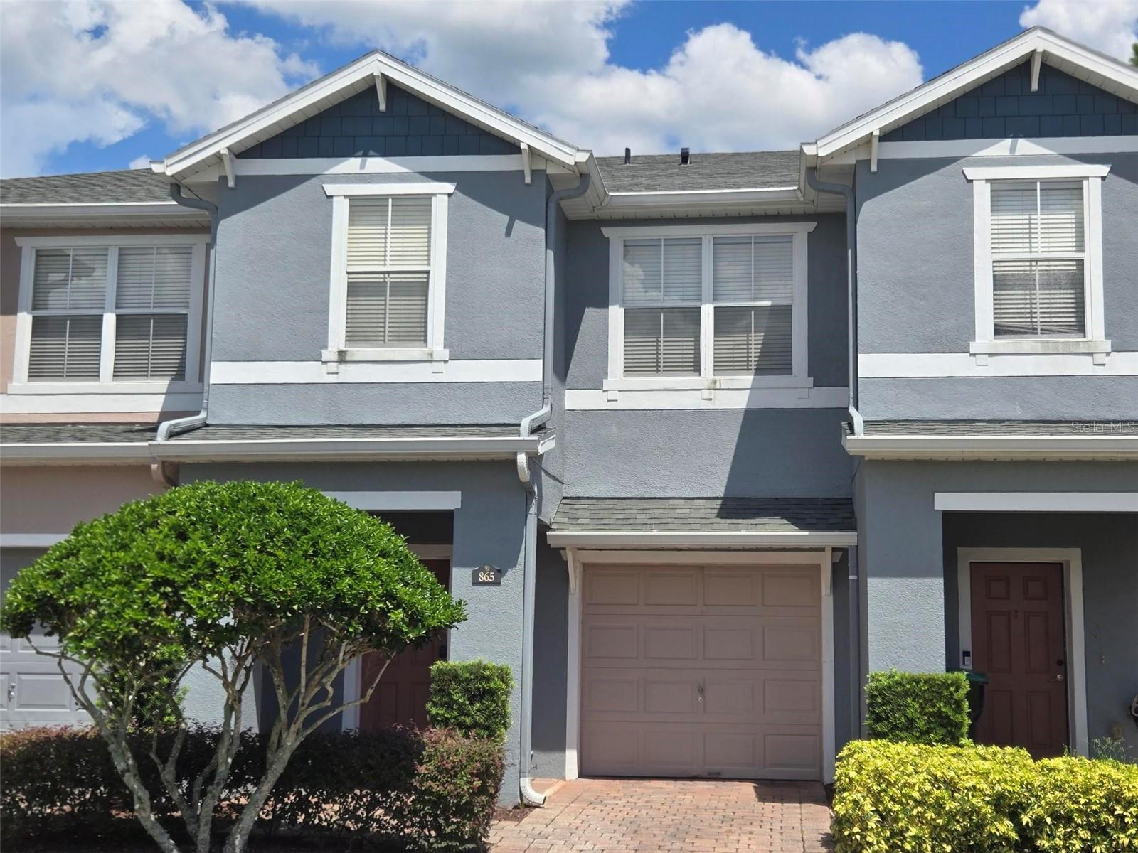 Cute and well laid out two-bedroom, two and a half-bathroom townhome in gated community in East Orlando. Full stainless steel kitchen package, oak cabinets, and breakfast bar. Bedrooms are on the second floor which is carpeted offering optimum privacy and separation of the living areas. Double owner suites feature ceiling fans, walk-in closets, garden tubs and with no back neighbors you have a wonderful unobstructed view of the great outdoors from the rear master bedroom. Hardwood floor on the entire first floor next to the one car garage for convenience when shopping or doing errands. You really need to see this to appreciate what is being offered. Walk out sliding glass doors to enjoy outdoor Florida living on your back open patio. The community features a pool and playground within walking distance of the property. Easy access to downtown Avalon Park, Waterford Lake Town Center, Siemens, Lockheed Martin, University of Central Florida. Hurry, don't let this one slip away from you.