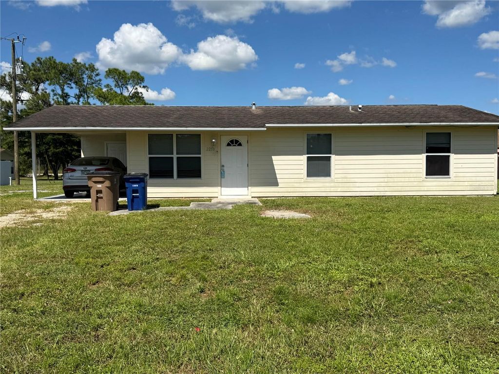 Photo of 2253 11th Terrace, Lehigh Acres, FL 33936 (MLS # TB8436788)