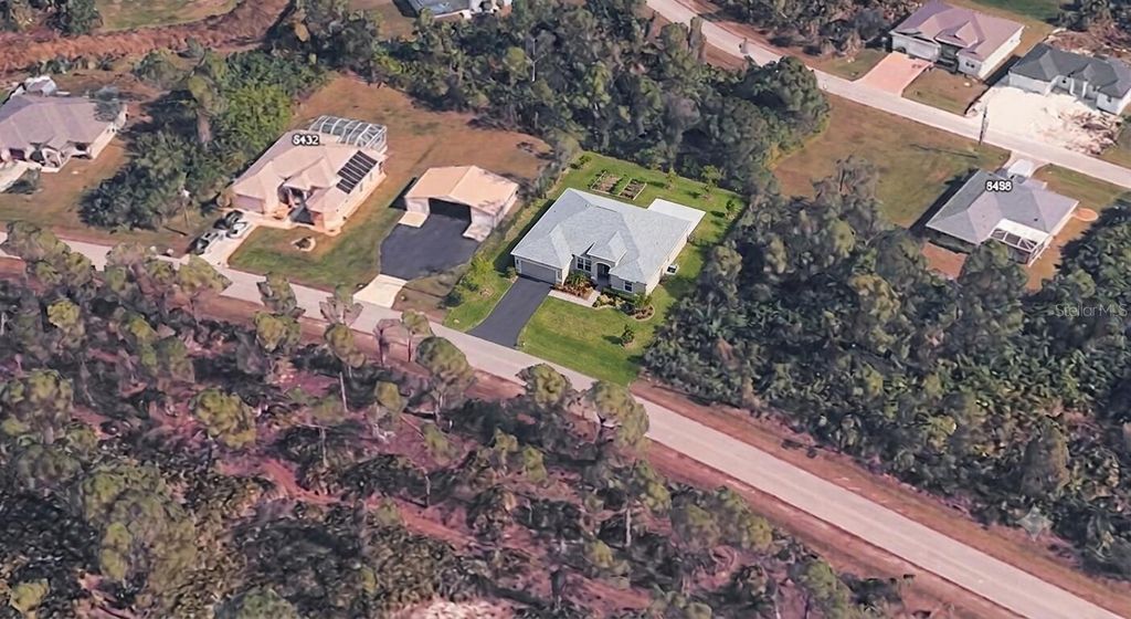 Photo of 8448 Matecumbe Road, Port Charlotte, FL 33981 (MLS # O6416338)