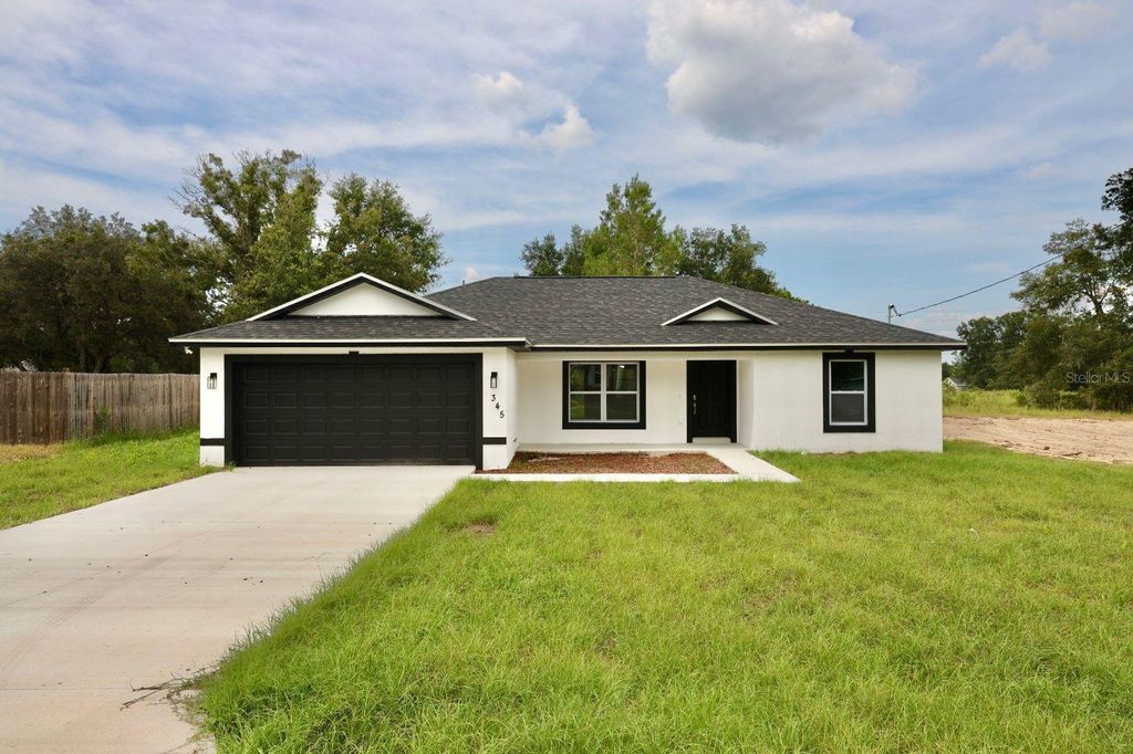 Photo of 345 Malauka Loop, Ocklawaha, FL 32179 (MLS # O6351337)