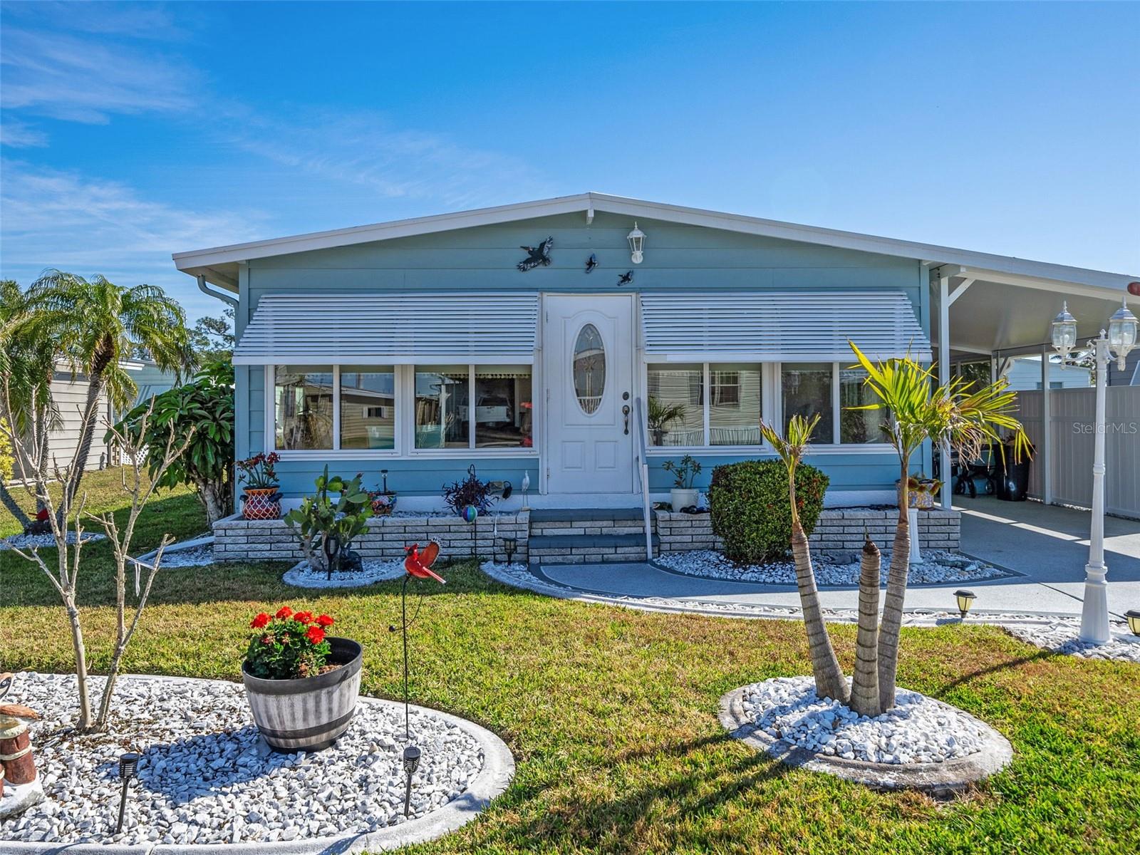 Welcome to this charming 2-bedroom, 2-bathroom home, nestled in the sought-after 55+ community of Harbor Isles in North Port. Offering a vibrant lifestyle and located in a 24-hour GATED community, it’s just waiting for you to enjoy everything this tranquil neighborhood and its incredible amenities have to offer! Outside, the beautifully landscaped front entry and driveway, featuring concrete curbing, rocked garden beds and a beautiful ornamental painted driveway, set the stage for a welcoming arrival. Two front awnings provide extra shade and add to its coastal charm. Step into the spacious, partially furnished home where you’ll immediately appreciate the thoughtful updates and open layout. The bonus space in the front entryway, complete with a new MINI-SPLIT system, is perfect for relaxing or entertaining friends for cocktail hour! The newly REMODELED kitchen is a true highlight, featuring solid wood white SOFT-CLOSE cabinetry, dove-tail drawers, pull-out pantry sliders and a full-tile backsplash! You’ll love the BRAND NEW stove and newer dishwasher, and the breakfast nook is a perfect spot for your morning coffee or a casual meal. The home’s inviting interior also features updated VANITIES in both bathrooms, a beautiful new TILED WALK-IN shower & glass door, with a transom window for natural light, along with brand-new LVP flooring throughout multiple rooms. The master bedroom is generously sized, complete with a large walk-in closet and a king size bed. The second bedroom has a unique bonus: the walk-in closet has been converted into an inside laundry/utility room, offering both convenience and functionality with an included washer and dryer. This room also has a built in murphy bed and closet for hosting guests and all your storage needs. In addition to the interior upgrades, this home features a new A/C (2023), new interior doors, a newer vapor barrier with new plywood sub-flooring, newer windows (installed 2017), and a new electrical panel—ensuring you have peace of mind with every season. The beautiful newer elite panel carport (installed 2022) offers sheltered parking, and the screened lanai invites you to enjoy Florida’s warm weather year-round. A spacious tool and storage room provides ample space for all your projects and belongings. Living in Harbor Isles means having access to a wealth of amenities right at your doorstep. Enjoy the community’s TENNIS, pickleball, shuffleboard, and bocce courts, or challenge your friends to a game of horseshoes. If you prefer something more relaxed, take a dip in the temperature-controlled POOL and SPA, or join one of the many organized activities. Boating enthusiasts will love the direct ACCESS to Salt Creek which leads to the Myakka River and the Gulf of Mexico via the community’s boat docks. Whether you're looking for a quiet retreat or an active lifestyle, this home offers the perfect combination. Now is the time to schedule your showing and discover all that this wonderful property and community have to offer!
