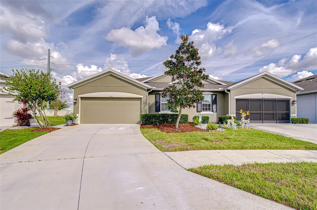 Photo of 10497 Heron Hideaway Loop, Land O Lakes, FL 34638 (MLS # TB8451381)