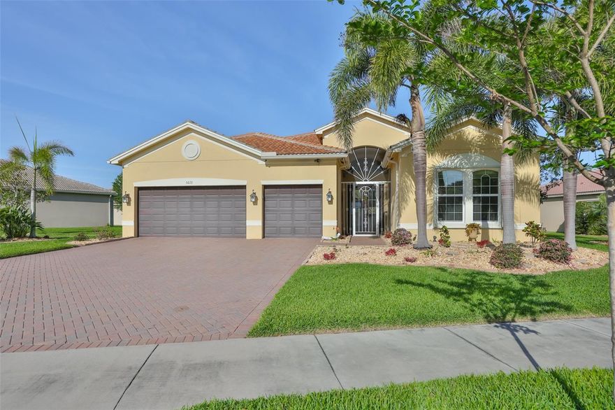 Welcome to this this beautifully updated home, set on one of the largest lots in Valencia Lakes—spanning over a third of an acre. This expansive Den Vizcaya model showcases more than $200,000 in recent upgrades that elevate its refined design, and it stands out as one of the few homes in the community to feature a private pool. The highlight of the home is its exceptional outdoor living space, complete with an outdoor kitchen and plenty of room for lounging and gathering with family—all while enjoying tranquil pond views and the soothing sound of the fountain. On cooler days, unwind in the hot tub and spa, or take advantage of the beautifully heated pool that includes pool lighting, a waterfall, and a fountain for year-round comfort. This generously sized home features 3 bedrooms, 3.5 bath, plus a built-in home office, which can easily be converted into a fourth bedroom by removing the built-in desks if desired. As you enter the grand foyer, you’re immediately greeted by exquisite custom woodwork, including crown molding, along with beautifully finished windows and sliding doors that add distinctive charm to the home. This home is outfitted with an impressive array of premium features, including an AC system with humidity control, a whole-house air purifier, bathroom heat lamps, an insulated garage door, and enhanced garage storage. The lanai is pre-wired for speakers, and the property is wired for perimeter security cameras. For added peace of mind, the home includes accordion hurricane shutters and outdoor security lighting. Additional conveniences include a whole-house intercom system and easy-open, self-gliding sliding doors leading to the pool area. Recent upgrades—such as a new water heater, pool filter, salt cartridge, air handler, and water softener—further elevate this home as a perfect blend of style, comfort, and functionality. The chef’s kitchen offers extensive upgraded cabinetry and generous granite counter space, perfect for meal preparation and entertaining guests. If you’re not a fan of the kitchen island  they can be easily removed. Start living the dream today in the Valencia Lakes community, featuring outstanding amenities including a 40,000 sq. ft. clubhouse, 24-hour fitness center, fitness classes, clubs, and a full calendar of events and concerts in the spacious social hall. Residents also enjoy game rooms, a sauna/spa, pools, softball field, RV and boat storage, tennis and pickleball courts, a community garden, and much more. The community offers a vibrant clubhouse, inviting pools, and an active social lifestyle. Conveniently located near Sarasota, St. Petersburg, and Tampa, you’ll have easy access to professional sports, arts and cultural attractions, and some of America’s award-winning beaches. Live where others only dream of vacationing. Schedule your showing today and discover the charm of this beautiful, move-in ready, custom-built home—you’re sure to fall in love!