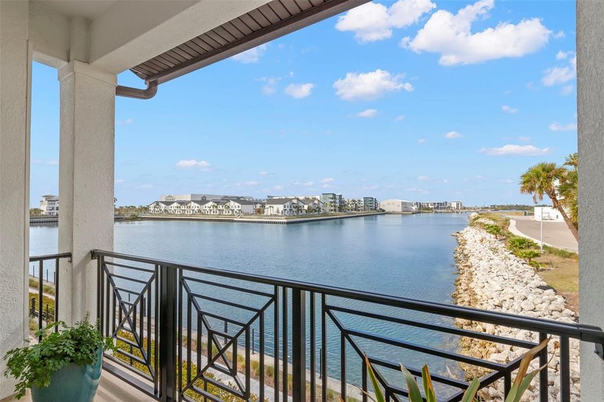 Few homes capture the Tampa waterfront lifestyle quite like this one! Perfectly located in the gated Inlet Shores community, this stunning waterfront residence sits directly along the water while remaining high & dry. With open water views from every level and a long list of post construction upgrades, this unit is a true standout! The home was designed to fully embrace the Florida lifestyle and has been thoughtfully enhanced with tens of thousands of dollars in upgrades that elevate the space with custom touches and thoughtful improvements. From the moment you step inside, the home feels bright, open, and welcoming. 10' ceilings on the first two floors, expansive windows, and warm neutral finishes allow natural light to pour in while keeping the focus on the water just beyond. Offering 4 bedrooms, 3.5 bathrooms, and a private elevator servicing all levels, the layout was designed to feel both elevated and effortless. The first floor features a private guest bedroom with its own full bath and patio, creating the perfect space for visitors, a home office, or a quiet retreat. Upstairs, the main living level is where the home truly shines. The kitchen is bright and inviting with abundant cabinetry and extensive recessed lighting, and it opens naturally to the living and dining spaces. Just off the living area, a waterfront patio offers the perfect place to relax, enjoy the breeze, and take in the open water views. The third floor hosts the primary suite and additional bedrooms. The primary retreat features a beautiful shiplap accent wall and a spa-inspired ensuite bath with a large walk in shower. All bedrooms throughout the home feature custom California Closets- a lux upgrade that adds both beauty and exceptional storage! This level also includes a true laundry room, a rare and welcome feature that makes everyday living that much easier. At the top of the home, the entire fourth floor is dedicated to an incredible rooftop terrace designed for outdoor living. With both covered and open air spaces, this level becomes a true extension of the home and takes full advantage of the sweeping open water views. It is the kind of space where mornings begin slowly and evenings wind down with a glass of wine while the sky fades from soft pinks to deep blues over the water. Whether hosting friends or enjoying a quiet night at home, the setting is simply spectacular. The terrace has been further elevated with a motorized hurricane screen and a fully equipped outdoor kitchen, making it just as ideal for relaxed nights at home as it is for entertaining friends & family. Additional upgrades include luxury vinyl flooring throughout the third floor, added shower glass in the upstairs guest bath, whole home water softener and filtration system, EV charger, custom window treatments, garage shelving/cabinetry, and more! Residents enjoy resort style amenities including a luxurious pool and lounge area, grilling station, lawn games, and a waterfront fire pit. Living in Westshore Marina District means stepping directly outside your front door to a waterfront walking path, coffee and smoothie shop, salon, local dining, and a specialty grocer, all just moments away. With quick access to Tampa International Airport, Downtown Tampa, Bayshore Blvd, and the Gandy Bridge to St Petersburg, this home offers the kind of elevated waterfront lifestyle that makes living in Tampa feel truly special!