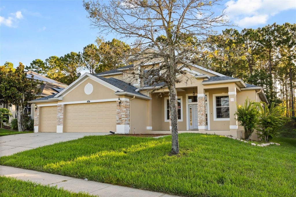 Photo of 1832 Nature Cove Lane, Clermont, FL 34711 (MLS # O6452866)