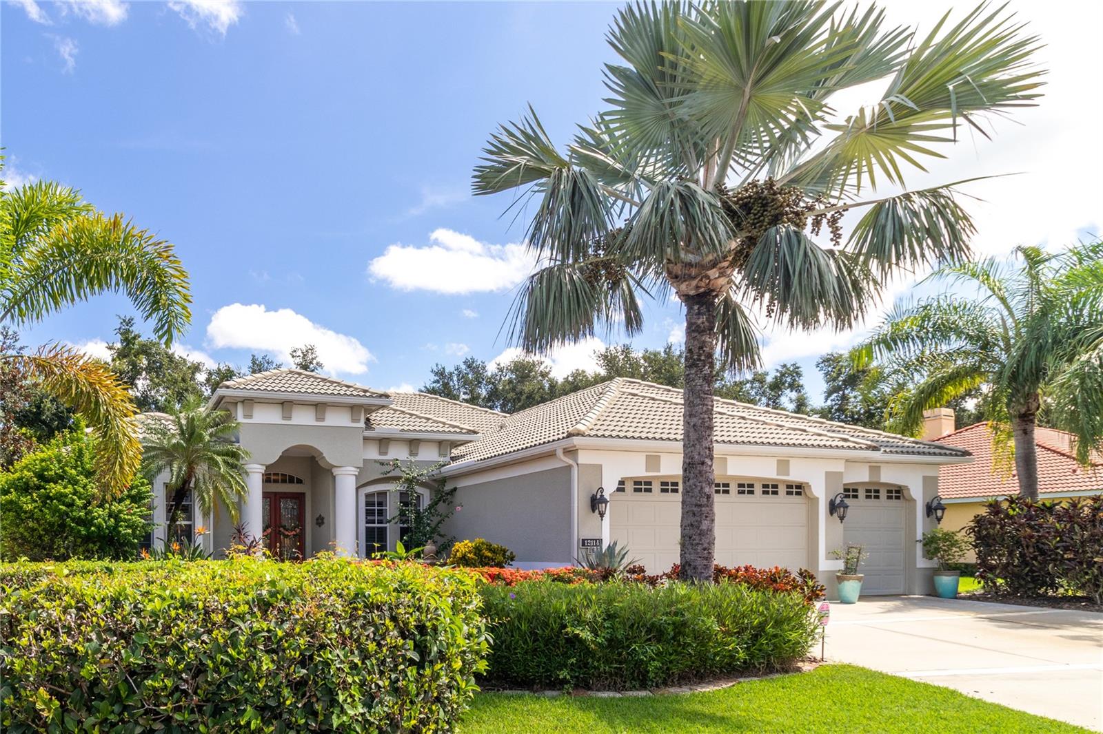 Experience refined Florida living in this meticulously maintained Lee Wetherington “Windham” model, nestled on a private cul-de-sac in the highly sought-after, guard-gated River Wilderness Golf & Country Club. Elegant features abound, including crown molding, custom millwork, an extended primary suite, and a resort-style heated pool & spa with dedicated lanai bath. In addition to these exceptional finishes, the home has received over $100,000 in recent upgrades—with the complete list provided in the Seller’s Documents. Inside, a gracious split-bedroom layout offers a serene owner’s wing, three spacious guest rooms, a private office, formal dining, and a light-filled family room. Outside, the expansive screened lanai and lush surroundings create a private retreat for both quiet mornings and lively gatherings. Optional club memberships offers championship golf, tennis, fitness, and dining, with a private community boat ramp to the Manatee River, no CDD fees, and the peace of mind of a 24-hour manned gate.