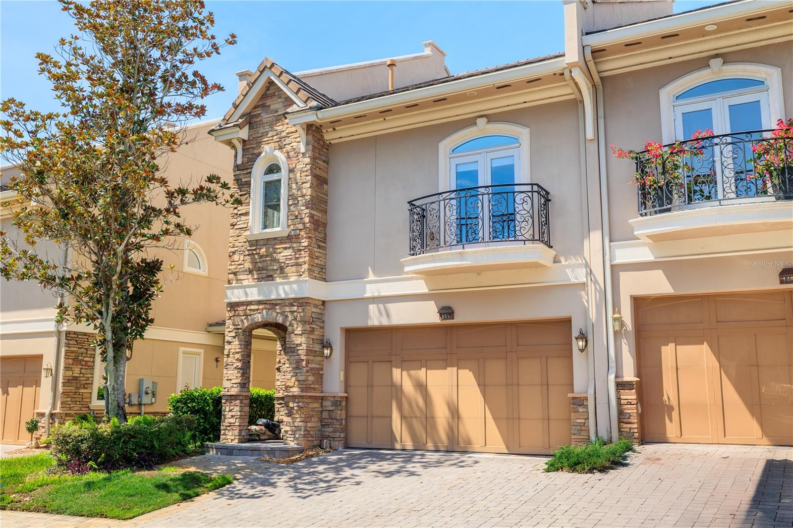 LUXURY, LOW MAINTENANCE living in this 3-story townhome in a gated community near Lake Tarpon - NOW AVAILABLE for lease. As you enter the all-block construction home, you'll notice the beautiful hardwood flooring, custom millwork and convenient elevator access. Located on the first floor are the kitchen, main living room, half bath, and outside is a SCREENED LANAI with HEATED SPA. Kitchen features 42" upper cabinetry, spacious pantry, granite countertops, NATURAL GAS COOKTOP and STAINLESS STEEL APPLIANCES. Located on the second floor are all of the SPACIOUS BEDROOMS, plus a dedicated office that could serve as a 4th bedroom. The expansive MASTER SUITE with a walk-in closet and master bath features double vanities with granite countertops, travertine tile floors, soaking tub and tiled shower. Two more bedrooms, an additional full bathroom and a centrally located laundry room are also on the second floor. The third floor is the ideal ENTERTAINING SPACE featuring a large sitting area by the fireplace, pool table (that will remain), half bath and a wet bar with refrigerator and microwave, perfect for gathering with friends, family or colleagues. This townhome is CONVENIENTLY LOCATED near top beaches, golf courses and central to both major airports (Tampa and Clearwater/St. Pete). Just a few blocks over is the waterfront restaurant, Tarpon Turtle, and Highland Nature Park, with playground and lakefront pier. Available for lease immediately on an annual basis, rent includes security system and all utilities. Schedule your showing today!