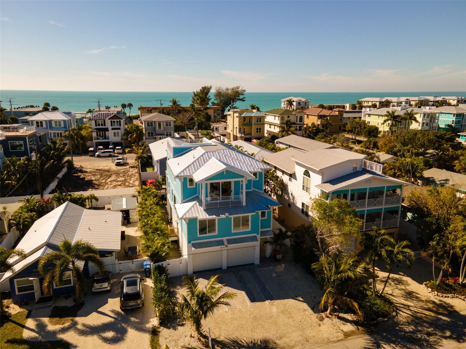 BRAND NEW CUSTOM CONSTRUCTION ON ANNA MARIA ISLAND HAS IT ALL. IT IS LOCATED 2 BLOCKS TO THE BEACH AND A BLOCK TO THE BAY. THIS NEW HOME HAS 7 BEDROOMS, 5 BATHS AND LARGE OPEN CONCEPT LIVING AND DINING AREA WITH WOOD LOOK CERAMIC TILE THROUGHOUT. KITCHEN AND BATHS FEATURE CUSTOM TILE DESIGN AND QUARTZ COUNTERTOPS. WOOD FINISHES THROUGHOUT THE HOME INCLUDE SHIPLAP ACCENTS, SHAKER STYLE DOORS AND CUSTOM MILLWORK. THE UPPER LEVEL INCLUDES A SPECTACULAR PRIMARY SUITE WITH SUNRISE VIEWS OVER THE BAY. A BONUS AREA IS ALSO A HIGHLIGHT ON THIS LEVEL. THE OUTDOOR AREA INCLUDES A POOL AND HOT TUB WITH IRRIDESCENT TILE SURROUNDED BY TROPICAL PLANTINGS AND COVERED LANAI. A ROOFTOP DECK OFFERS BEACH TO BAY VIEWS. A THREE CAR GARAGE OFFERS AMPLE SPACE FOR CARS AND GOLF CART. A CITY PARK WITH PLAYGROUND, PAVILLION AND ACCESS FOR KAYAKING OR FISHING. THIS PROPERTY IS A PERFECT SECOND HOME OR VACATION RENTAL WITH GREAT SPACE FOR ENTERTAINING A LARGE NUMBER OF PEOPLE.