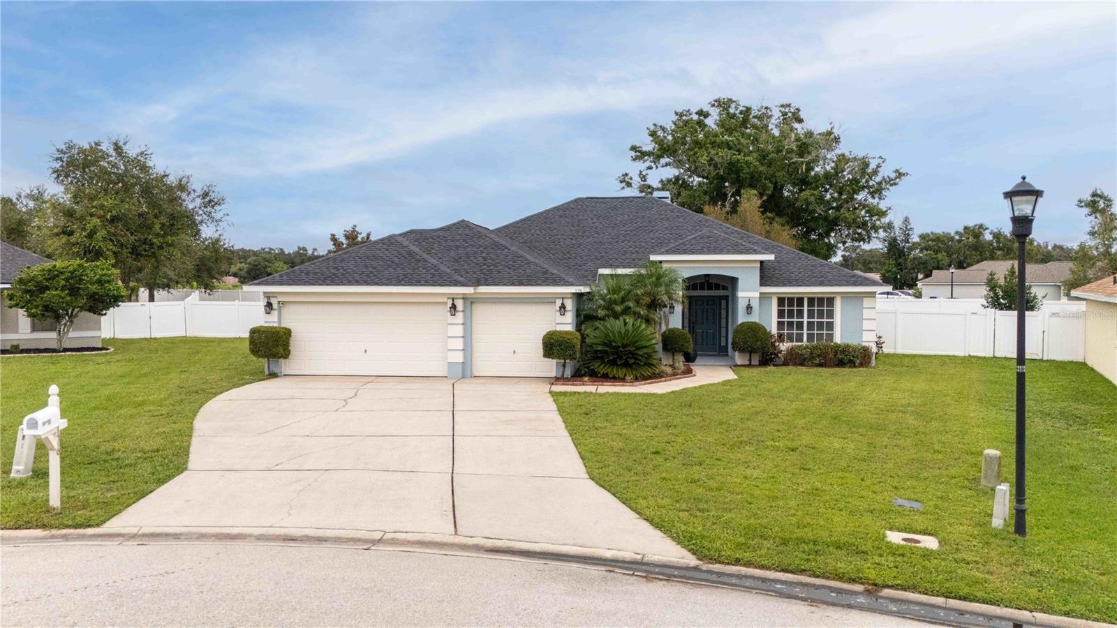 Welcome to your idyllic sanctuary in Amber Estates, located in serene Auburndale, Florida. Come take a look at this stunning home that features four bedrooms and three bathrooms. The open floor plan is bathed in light, showcasing updated luxury vinyl flooring and stylish new fixtures. Gather around the cozy fireplace or prepare meals in the modern kitchen with gleaming stainless steel appliances. Step out onto the expansive fenced yard, perfect for entertaining or leisure. Don't miss the large lanai and three-car garage, paired with an extended driveway for convenience. Nestled in a peaceful cul-de-sac, this lovely home boasts a new roof from 2024, a new A/C unit for 2025, and low HOA fees, ensuring comfort and tranquility in your new haven.
