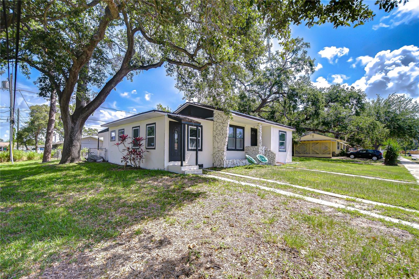 Available for annual lease, this 3-bedroom, 2-bath home in charming Gulfport sits on a spacious, fully fenced corner lot with double-gate entry and a massive shed/garage—perfect for storing all your tools and toys. Step into a bright living room that flows seamlessly into the kitchen and dining area, all finished with sleek laminate floors. The kitchen offers plenty of storage, featuring double pantry closets flanking the refrigerator. Both bathrooms have been tastefully renovated, and modern comforts like energy-saving Tesla solar panels and a REEM tankless hot water heater help keep your utility bills low. The master bedroom suite features an en-suite bathroom with a jetted tub and its own separate entrance for added convenience and privacy, while the two guest bedrooms remain generously sized and light-filled. Just a block from the Pinellas Trail and perfectly positioned between St. Pete’s award-winning Gulf beaches and Downtown Gulfport’s vibrant arts scene, you’ll have top restaurants, unique shops, and sandy shores at your fingertips. You’re only 10 minutes from the beach, 10 minutes from trendy downtown St. Petersburg, and a quick 30-minute drive to Tampa International Airport. Don’t miss this exceptional Gulfport retreat—schedule your private showing today!