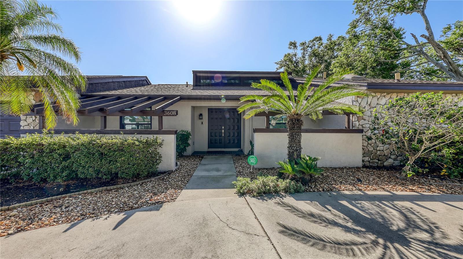 Tucked away among mature trees and lush landscaping, this exquisite 3–4 bedroom, 2.5-bath custom-built home offers a perfect blend of privacy, timeless design, and everyday functionality. Lovingly maintained by its original owners, the home showcases a harmonious mix of comfort and thoughtful upgrades throughout.
At the heart of the home lies the chef’s kitchen, complete with custom soft-close cabinetry, stunning 3M Cambria Weybourne quartz countertops, a decorative backsplash, under-cabinet lighting, and a sleek LG stainless steel appliance package. A central island enhances prep space, while a convenient pass-through window opens to the screened pool patio—ideal for entertaining.
Modern updates include Lico Swiss-engineered luxury vinyl plank flooring throughout, vaulted and textured ceilings, recessed lighting, and impact-resistant windows . The expansive family room, featuring a skylight for natural light, flows effortlessly into a screened lanai and a private, heated 25x17 pool with built-in jacuzzi jets. The surrounding 25x40 patio provides the perfect backdrop for outdoor gatherings in your personal tropical oasis.
The circular driveway offers ample parking for guests, making it easy to host friends and family.
Designed with a smart split floor plan, the spacious primary suite features dual walk-in closets and a spa-style bath with a soaking tub, walk-in shower, dual sinks, skylight, and private water closet. Two additional bedrooms are tucked away on the opposite side of the home, along with a versatile office/den with built-in desk—easily convertible into a fourth bedroom.
Additional features include formal living and dining rooms, a casual breakfast nook, a central vacuum system, and a fully replumbed system including the main line to the street. The oversized garage includes a separate door for a golf cart, and the impact-rated garage door installed
This one-of-a-kind home offers the ideal combination of elegance, comfort, and practicality—nestled in one of the area’s most sought-after communities.