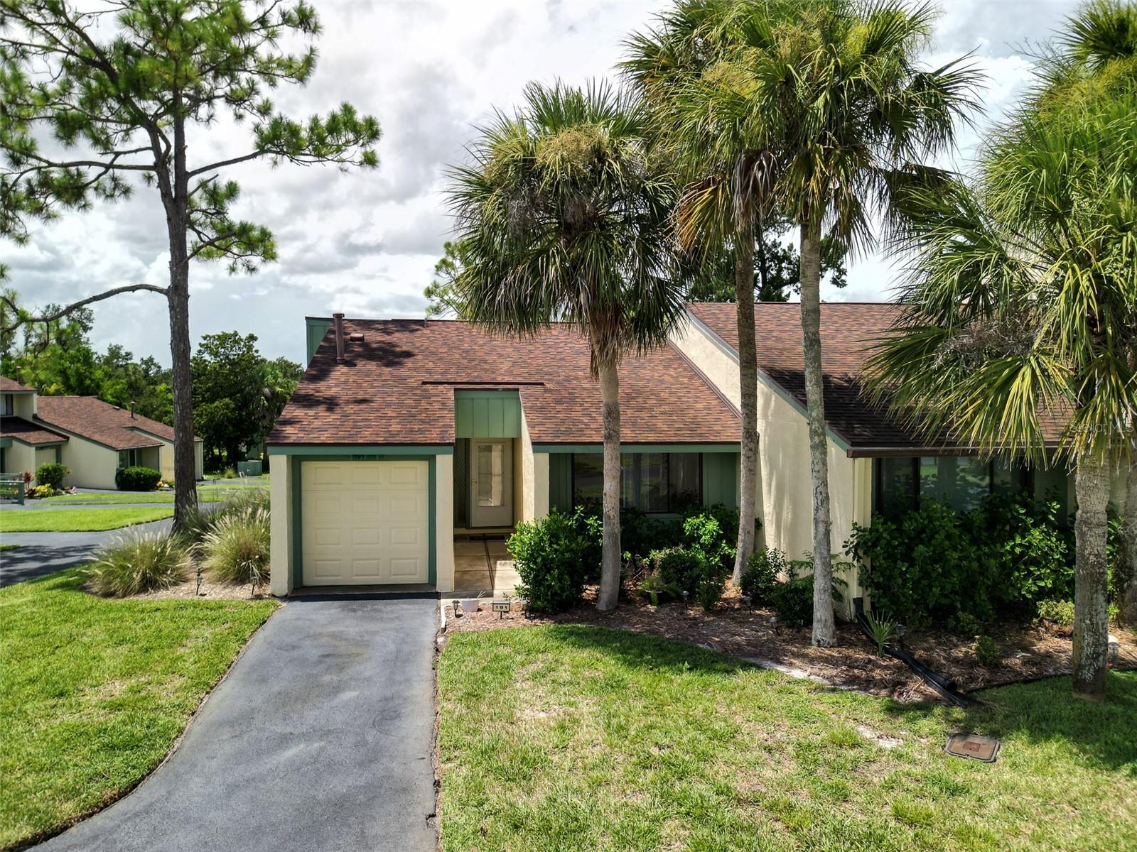 **Charming 1-Bedroom Golf Villa in Private Country Club Community of Sugar Mill CC**
Discover relaxed, resort-style living in this beautifully maintained 1-bedroom, 1.5-bath end-unit villa nestled within a prestigious private country club community. This rare end unit offers added privacy, abundant natural light, and peaceful views of the nearby community pool from the spacious rear deck—perfect for morning coffee or evening relaxation.
Step inside to find elegant engineered wood flooring throughout the main living areas, enhancing both style and durability. The open-concept layout features a comfortable living space, a dining area, and a well-appointed kitchen—ideal for easy living and entertaining.
Additional highlights include:
* Dedicated golf cart garage for ultimate convenience
* Assigned vehicle parking space
* 1.5 bathrooms, including a convenient guest powder room
* Access to a sparkling community pool just steps away
Whether you're an avid golfer or simply seeking a serene and secure lifestyle, this villa offers the perfect blend of comfort and community in one of the area's most desirable golf enclaves. Several membership options available for the Private CC. Inquire within.