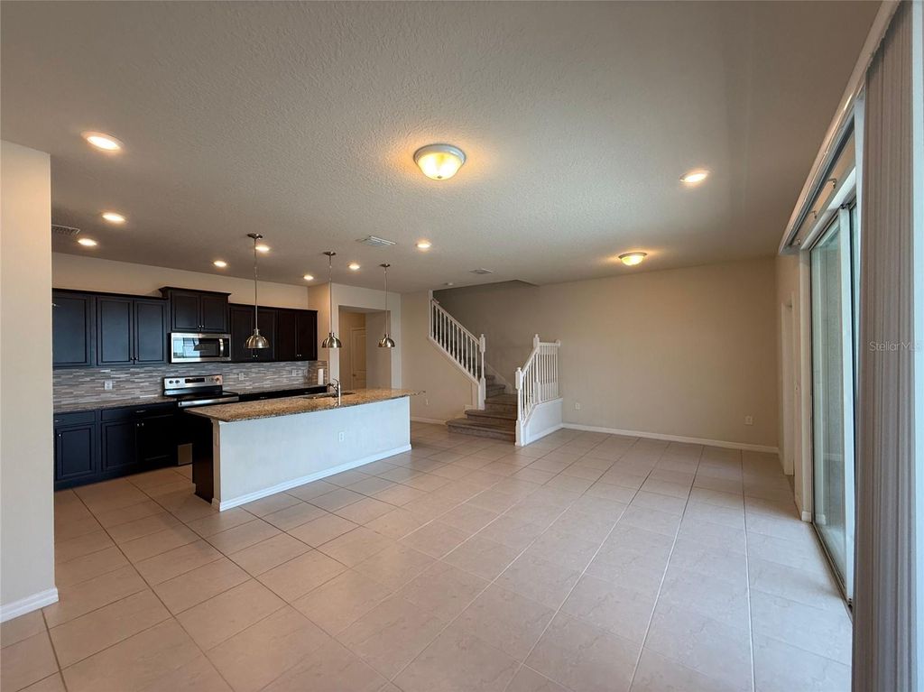 Photo of 607 Jasmine Lane, Davenport, FL 33897 (MLS # O6333771)