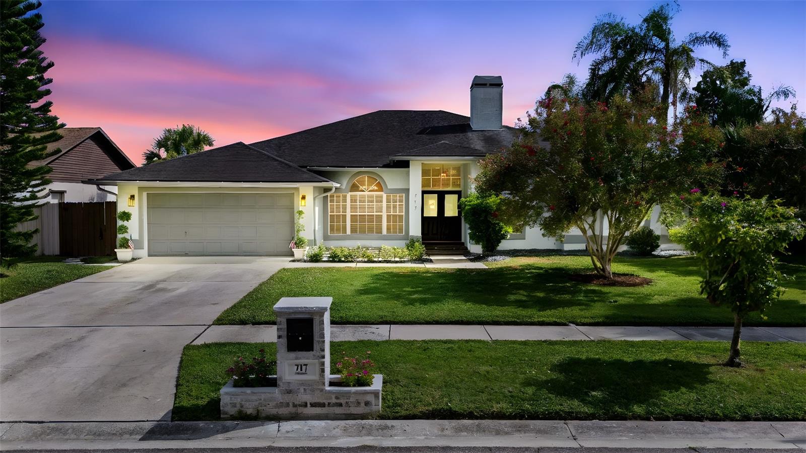 One or more photo(s) has been virtually staged. Dream Home Alert! This rare lakefront find is truly an everyday getaway, offering not just a house, but a lifestyle. Imagine PURE Florida living at its finest: vacation vibes right at home, with your own private dock on the lake, no rear neighbors, and peaceful conservation views. Step out onto this expansive covered lanai and instantly feel like you’re on vacation. With plenty of room for outdoor dining, lounging, and entertaining, this space is made for Florida living. Overlooking the sparkling screened-in pool and framed by swaying palm trees, you’ll enjoy serene water views that bring a true tropical vibe to your backyard. Whether you’re hosting a weekend gathering or simply relaxing with a cool drink in hand, this lanai offers the perfect blend of shade, comfort, and resort-style ambiance, all while capturing the beauty of the water just beyond.
This beautifully landscaped property sits on over a quarter acre and even extends under the lake toward the conservation, ensuring uninterrupted views and unmatched privacy. Inside, the open single-story floor plan is filled with natural light and designed to showcase the outdoors. The expansive three-panel sliding glass pocket doors fully retract to create a seamless connection between the living area and lanai, giving you that breezy, open-air patio feel, especially refreshing during Florida’s cooler winter months.
Step through the etched glass double-door entry into an elegant foyer, with the formal dining room to the left and a home office with French doors to the right. A wood-burning pass-through fireplace connects both the office and the spacious living room, creating a cozy ambiance and the perfect spot to gather during the cooler Florida winter months.
The kitchen features a breakfast bar, and dinette overlooking the lanai, making it perfect for both entertaining and everyday living. The split bedroom layout provides privacy for all: the large primary suite is a true retreat, with a bay window framing lake views and two walk-in closets. The beautifully remodeled en-suite bath feels like a spa, with a generous walk-in shower, dual new vanities, a private water closet, and a relaxing garden tub, the perfect spot to unwind after a long day.
On the opposite side, you’ll find a bedroom with a walk-in closet, along with an oversized third bedroom offering endless possibilities. This flexible space could serve as a nursery & playroom, a teenager’s dream room with space to spread out (or even divide into zones), a large guest retreat, or private in-law quarters. The options are wide open, making it easy to tailor the home to your lifestyle. Outdoor living shines with a screened and covered lanai, and a winding stone walkway leading to your dock, perfect for fishing, kayaking, or simply soaking in the tranquil view. SOLAR PANELS PAID OFF
UPDATES: 2025: sellers invested heavily in thoughtful upgrades: brandnew kitchen with new cabinets, quartz countertops, backsplash & lighting. 2022: upgraded kitchen appliances (approx. $40,000); new interior paint,new pool pump; 2022-2025 : updated guest & primary baths, black aluminum fence in backyard; pool safety fence; renovated sprinkler system with smart controller; custom-built brick mailbox with planters; upgraded interior & exterior light fixtures; brick paver path along the garage side; custom 15x15 front patio, all adding modern convenience & curb appeal. 2021: new ductwork & insulation, pool pump & water heater ; 2018 HVAC, 2017 Roof.