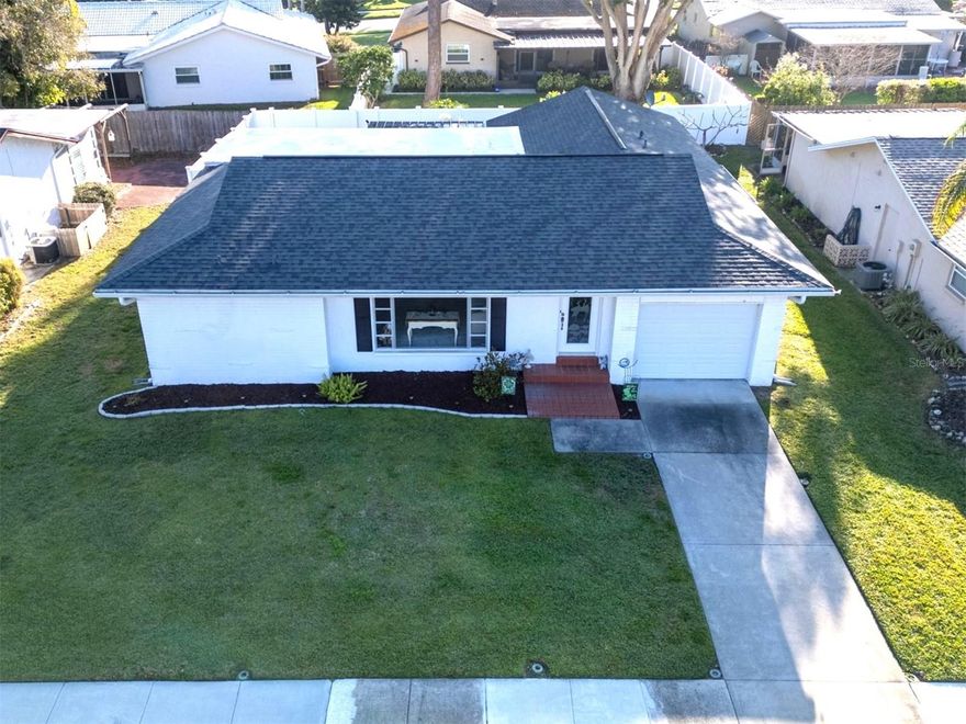 Welcome to this charming, SPACIOUS, 2-bedroom, 2 full bath home with a 1-car garage in the highly desirable 55+ community of Anchorage of Lake Tarpon — a LIGHT, BRIGHT, and beautifully designed residence that would make the perfect Florida winter retreat or an ideal place to retire and enjoy the sunshine year-round.

This thoughtfully designed home features an extra-large formal living and dining area, offering wonderful space for entertaining or relaxing in comfort. The SPLIT-BEDROOM floor plan ensures privacy, with a spacious primary suite on one side featuring a BRAND NEW SHOWER, while the second bedroom and full bath are located on the opposite side — perfect for guests.

Just off the kitchen, you’ll find a versatile bonus room ideal for a home office, craft room, hobby space, or cozy reading nook. The backyard was fully fenced in 2019 with white vinyl fencing, creating a private outdoor space to enjoy Florida’s beautiful weather.

Major updates provide peace of mind, including a NEW ROOF and gutters (2019), water heater (2020), and HVAC (2016). The sprinkler system runs on a well for efficient irrigation. Located in a NO FLOOD ZONE — and this home had no flooding — offering added security and confidence.

Anchorage residents enjoy fantastic amenities including a clubhouse, large pool, game area, library, and a full calendar of social events — all with a low HOA fee of just $500 per year. The community is quiet, friendly, and beautifully maintained.

A true standout feature is that JOHN CHESTNUT SR PARK is just steps away. This stunning 250-acre Pinellas County park on Lake Tarpon offers scenic walking trails, boardwalks, picnic areas, a dog park, boat ramp, and frequent wildlife sightings — including deer.

Conveniently located near shopping, medical facilities, the YMCA, the Pinellas Trail, and beautiful Gulf beaches, this home offers the perfect blend of comfort, convenience, and nature.

Don’t miss this opportunity — homes in this sought-after community do not last long!