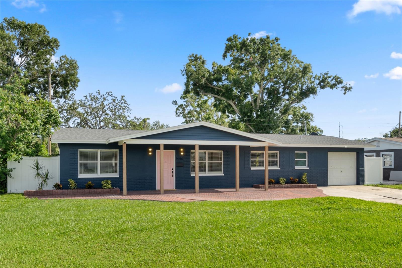Updated Terrazzo Dream House - gleaming original terrazzo floors in a totally updated 4bd/2ba+1-car garage home. Enjoy the privacy of a split-bedroom layout with a WALK-IN CLOSET, a modern kitchen with granite countertops, expansive lanai, and fenced in backyard large enough for a pool. This move-in ready property features smooth drywall, new exterior and interior paint, new interior doors, tasteful light fixtures, and elevated finishes throughout. Updates include: Roof (2019), HVAC and Ductwork (2019), updated electrical, and updated windows + impact glass sliding doors. Reach Target, Home Goods, Trader Joe’s, Whole Foods, Crunch Fitness, and dining + shopping options that St Pete's 4th St Corridor has to offer within 5-10 minutes. BLOCK CONSTRUCTION + NEVER FLOODED.
