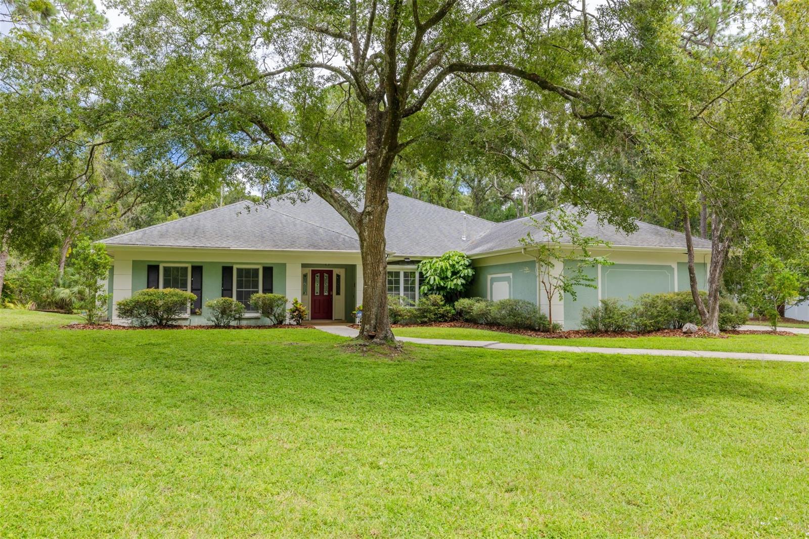 Located in the desirable equestrian neighborhood of Twin Branch Acres, this impressive home sits tucked away on a quiet cul-de-sac and offers just over 3,800 sq ft of living space, with more than 3,300 sq ft on the first floor alone. As you walk through the front door, you’re greeted with stunning views of the pool and wooded backyard, setting the tone for the serene lifestyle this property provides. Inside, you’ll find 5 bedrooms, 3 bathrooms, a formal dining room, living and family rooms, plus a versatile upstairs bonus room. The large primary bedroom is a true retreat, complete with a walk-in closet and a spa-like ensuite featuring a Jacuzzi tub and double vanity. Convenience is enhanced with an indoor laundry room and a spacious 3-car garage. Nestled on nearly 2 acres and backing to conservation land, the property offers both privacy and plenty of space—with the flexibility to have horses. Nature lovers will enjoy the abundance of wildlife, including frequent deer sightings right in the backyard. Step outside to enjoy the sparkling pool and newly screened lanai, perfect for Florida living. Practical updates include a top-of-the-line 2023 HVAC system for the first floor, all-new ductwork in 2019, a 2019 roof including flat roof sections, an 80-gallon high-efficiency hybrid water heater, and a new electrical panel—all in a non-required flood zone for peace of mind. Plus, it’s conveniently located just 8 miles from Tampa International Airport and 9 miles from the Clearwater-St. Pete Airport. This Twin Branch Acres retreat combines equestrian living, comfort, and tranquility in a setting you’ll love coming home to.