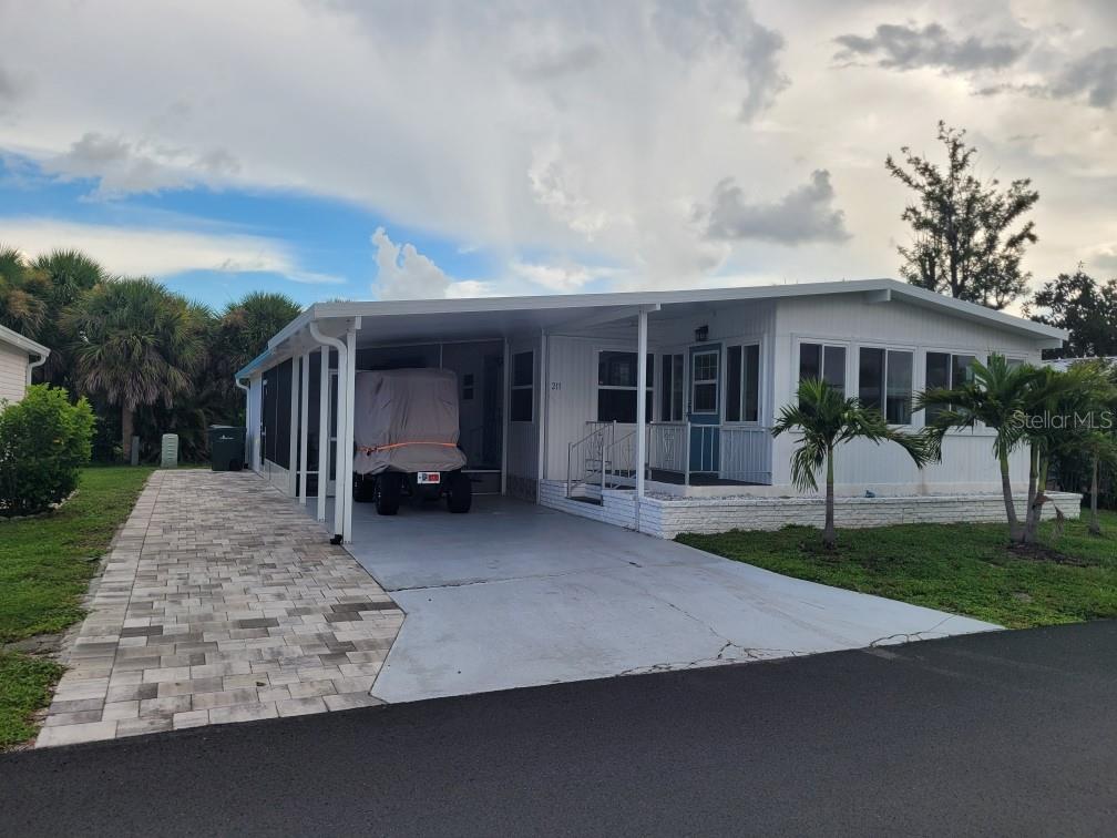Charming 2-bedroom, 2-bath home nestled in a vibrant 55+ community. This well-maintained residence boasts recent upgrades, including kitchen countertops, cabinets, and appliances. Open concept living room, kitchen and dining area. Enjoy the spacious and bright Florida room, perfect for relaxing or entertaining with natural light. The oversized Primary bedroom with an ensuite bathroom with tiled walk-in shower. Plenty of room in the 2nd bedroom use as a guestroom for overnight guest. Outside you will love the screened in lanai and large shed that includes washer and dryer plus a workshop area ideal for hobbies, projects or extra storage. Located in a quite community, this home is perfect full time resident 55+ or seasonal retreat. The park amenities are numerous and include 2 heated pools, 2 hot tubs, a fitness center, tennis courts, bocce ball, corn hole, horseshoes, billiards, ping pong, games room, Tiki Hut, 2 Club Houses, and free community bus transportation to local shops and outings. Located just minutes from downtown Venice and pristine beaches with easy access to shopping, dining, and other entertainment options. Whether you are enjoying a sunset on the beach or exploring the charm of downtown Venice, this location offers the best of Florida living.