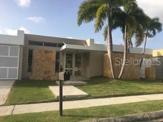 Lovely home in one of Guaynabo's best neighborhoods. Torrimar where the property is located is in the heart of Guaynabo close to schools, supermarkets, Costco and Sams, many restaurants, movie theaters, and sports facilities. This home sits on one floor and has an open concept style. It enjoys a formal living and dining room, two family rooms, four bedrooms plus a maids room. Large kitchen with excellent appliances, separate large refrigerator and freezer, dishwasher and wine cooler. The kitchen has a counter area with stools and also an informal dining room. Outside areas include a gazebo area with outdoor kitchen and dining area, a large pool and terrace. Included are all inverter ac units, all appliances, solar water heater and generator with automatic transfer switch. Partially furnished.