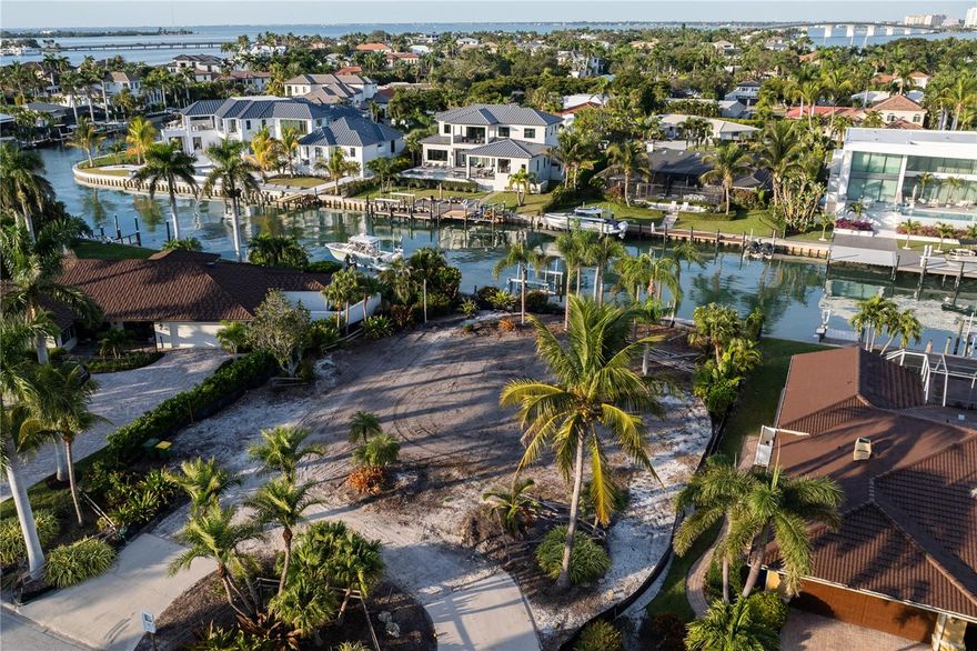 Rare permit-ready canal-front lot on prestigious Bird Key offering a streamlined opportunity to build a luxury coastal residence without the usual design delays. This prime homesite includes a complete set of architectural drawings, structural plans, and a full design package—professionally created and ready for immediate construction. Partner with Dynan Construction, Sarasota’s premier luxury builder, celebrated for high-quality craftsmanship, elevated coastal design, and engineering built to the Fortified Gold Standard. Buyers may choose to move forward with the existing modern design or customize finishes with Dynan’s team. Located on a desirable deep-water canal with quick access to Sarasota Bay, this property is ideal for sailing and yachting enthusiasts, offering effortless access to open waters. Bird Key is renowned for its vibrant boating culture, and the brand-new Bird Key Yacht Club scheduled for completion in 2026 will further elevate community amenities. Beyond the waterfront lifestyle, residents enjoy unmatched convenience to downtown Sarasota’s cultural attractions, including world-class dining, performing arts, and galleries, as well as St. Armands Circle and Lido Key beaches. A rare, turn-key luxury build opportunity awaits on one of Bird Key’s most sought-after waterfront parcels—perfectly blending coastal living, boating, Sarasota’s rich cultural scene, and the resilience of the Fortified Gold Standard