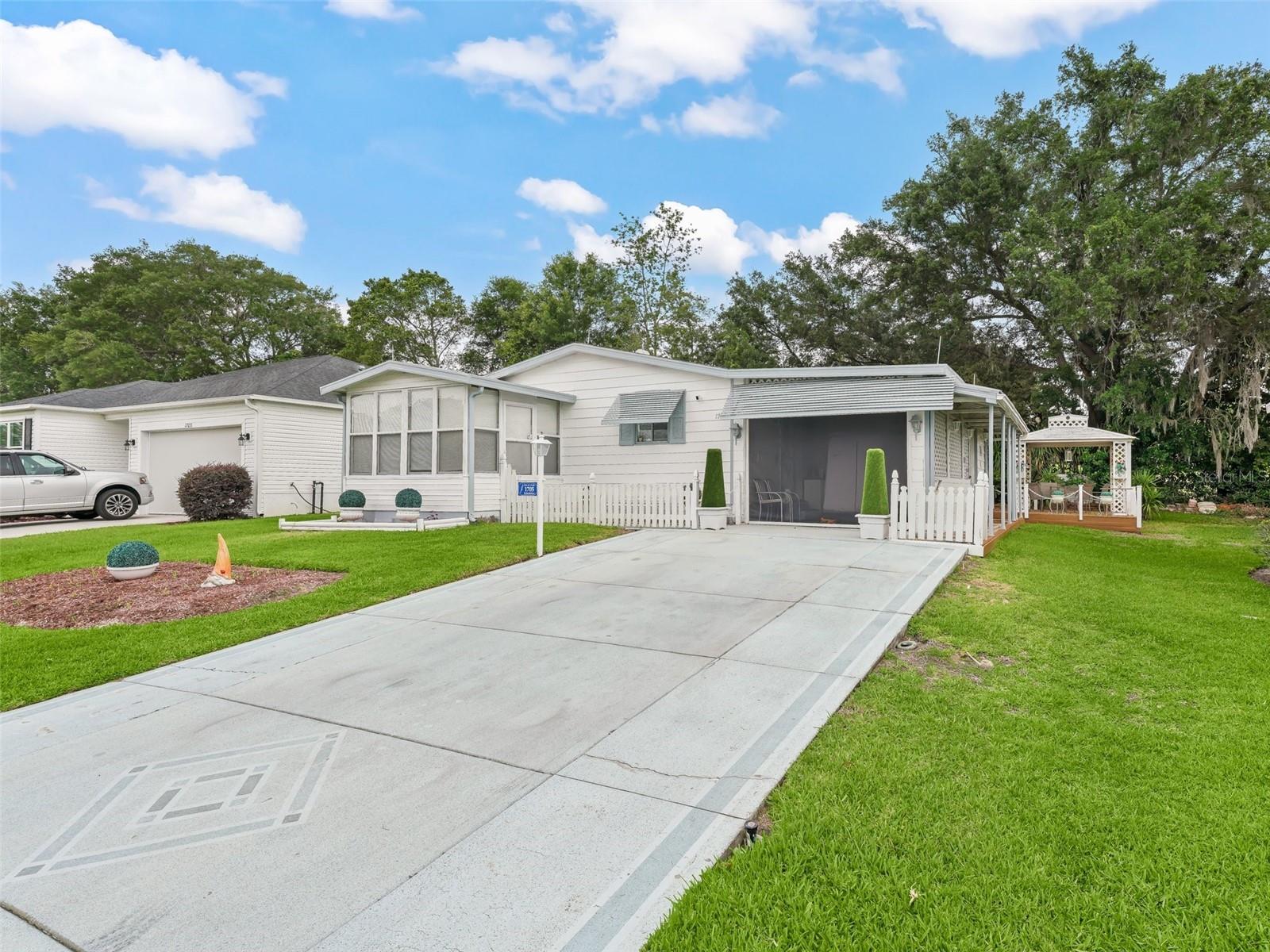 RENT BEFORE YOU BUY!!! This 2-bedroom, 2-bathroom manufactured home is in the Village of Orange Blossom. The kitchen is fully equipped. The living room includes a seating area and a Smart TV. The master bedroom has a king bed, Smart TV, and an ensuite bathroom with double sinks, a walk-in shower, and a separate toilet area. The guest bedroom has a queen bed and is near a bathroom with a tub/shower combo and linen closet. Outdoor features include an enclosed lanai and a screened lanai with a motorized screen door. A new golf cart is included. Located under 5 minutes from Spanish Springs, Orange Blossom Golf & Country Club, Paradise Family Pool & Rec Center, Hilltop Adult Pool, restaurants, and shopping.
July-October monthly $2250 plus taxes & Fees-November $2175 plus taxes & fees--December $2550 plus taxes & Fees-- PLEASE CALL FOR PEAK SEASON(JAN-MAR) & WEEKLY RATES
