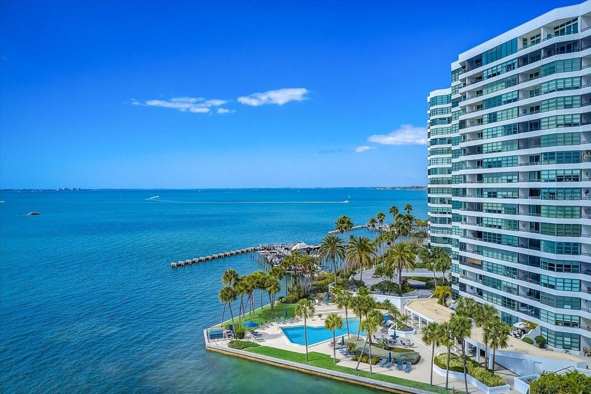 Where downtown meets the Bay, You can have it all at this direct waterfront community where no one will ever build in front of you and block your endless sunset views. Enjoy the waterfront lifestyle and the conveniences of living downtown. YES, we have 4 pickleball courts and 1 tennis court. This 2/2, 1642sf has spectacular sweeping views over Longboat Key to the Gulf. The 14th floor features a sky lobby for gatherings and sunset. It is situated on a 9-acre gated peninsula with 24 hr security and is located next door to the world class Bay Park with its many amenities. Throughout the condo are matching maple Cucina Lube cabinets, granite countertops and designer glass sinks in the baths. The combination living room/dining room are surrounded by windows giving you nonstop water, dolphin and manatee views. The kitchen has a breakfast bar, Murano glass ceiling fixture, Kenmore Elite french door refrigerator with double freezer drawers, and a Kenmore Elite stove. The living/dining area opens up to your balcony with floor to ceiling sliders. Recent improvements include all new 24 x 24 porcelain tile in the living area, foyer & kitchen. New dishwasher in Oct 2024 and new AC w/ UV light and guest room carpet in Dec 2024. The primary bedroom features woven wool carpet and a large ensuite with a walk in shower with 5 shower heads, double glass pedestal sinks, maple Lube cabinets with granite countertops, custom walkin closet with a dresser. The large guest room has a custom walkin closet with a dresser and has room to use it as an office as well. The guest bath also has double pedestal sinks and a tub/shower. All the windows are tinted to reduce glare and have Duette shades. There is a reverse osmosis filter under the kitchen sink. On The 14th floor boasts a coveted sky deck where you can gather for sunset or no reason at all. There are only 5 in the building. Condo on the Bay is in the middle of a planned exterior update including the roof, fitness centers and stucco painting and repair. The milestone report was good and is available for review. The property will have an almost total renovation by the time all the projects are done. If you are looking for a place to dock your boat or kayak you can't ask for more convenience than walking out your door. Within walking distance are many restaurants, concerts, parks, shopping, entertainment. Lido Beach is just 2 miles away, Siesta, 5 miles and the airport 4 miles. Looking to make friends? This is a very friendly place to live. There are organized social activities, happy hours, dining out, mahjong, water aerobics, walking groups, etc and get togethers for no reason. Your Hoa fee includes all utilities except electric. All pets must have either an emotional support letter or service animal documentation. Offers must include proof of funds.