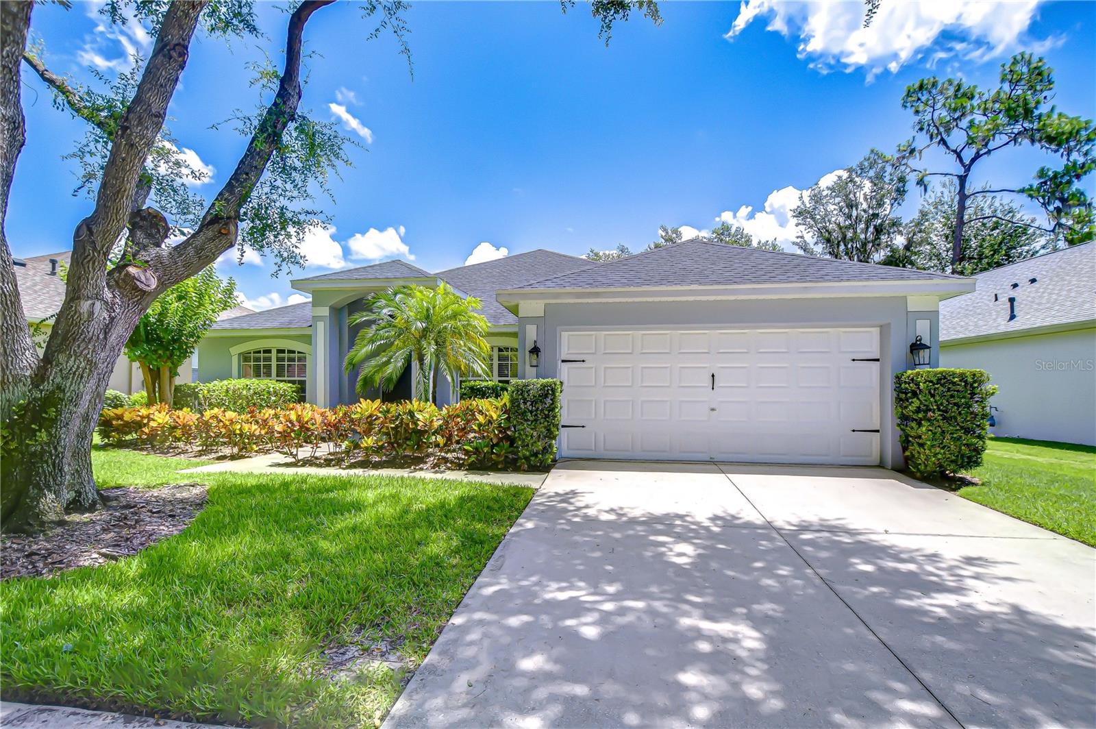 Welcome to this beautifully maintained home located in the highly sought-after community of FishHawk Ranch, where resort-style living, top-rated schools, and endless amenities are all within walking or biking distance. Perfectly situated near Tampa, MacDill Air Force Base, world-class beaches, and championship golf courses, this home offers the opportunity to live every day like you’re on vacation. Pride of ownership is evident throughout with major updates already completed, including a new roof in 2020, AC replaced in 2018, exterior painted in 2022, and fresh pool deck paint in 2023. Inside, you’ll be greeted by soaring vaulted ceilings, elegant chandeliers, and durable laminate flooring that flows through the formal living room, formal dining room, and expansive family room. The light and airy Agreeable Gray color palette complements a variety of décor styles, from coastal to farmhouse, traditional, or shabby chic. The heart of the home is the stunning chef’s kitchen featuring quartz countertops, abundant cabinet space, a large center island, gas range, and a convenient pantry. A charming breakfast nook with a window overlooking the front yard creates the perfect space to start your mornings, while oversized sliding doors from both the kitchen and family room offer picturesque views of your private backyard oasis. The primary suite is a true retreat with direct access to the lanai, along with a spa-like ensuite bathroom complete with granite countertops, dual sinks, a relaxing soaking tub, oversized walk-in shower with dual showerheads, and a spacious walk-in closet. On the opposite side of the home, you’ll find three secondary bedrooms, including one with a dream closet and custom organizers for maximum storage. The updated pool bath, completed in 2019, offers convenient outdoor access. Upstairs, the fourth bedroom offers flexible space that is ideal for a home office, playroom, guest suite, or media room. Step outside to your private screened lanai featuring a sparkling pool and spa, both resurfaced in 2020. Additional updates include a new gas heater in 2020, a pool pump, filter, and spa light replaced in 2021, and privacy hedges that complete your fenced backyard sanctuary. Additional upgrades include an XL water heater replaced in 2021, a whole-home water softener system, and a Tesla charger installed in the oversized two-car garage with ample storage. The laundry room offers even more functionality with built-in shelving for pantry items or extra storage. This home has been meticulously cared for and offers the perfect blend of comfort, functionality, and resort-style living in one of the area’s most desirable communities. Copy and paste this link to tour the home virtually: my.matterport.com/show/?m=E4HqjdDxvUa&mls=1